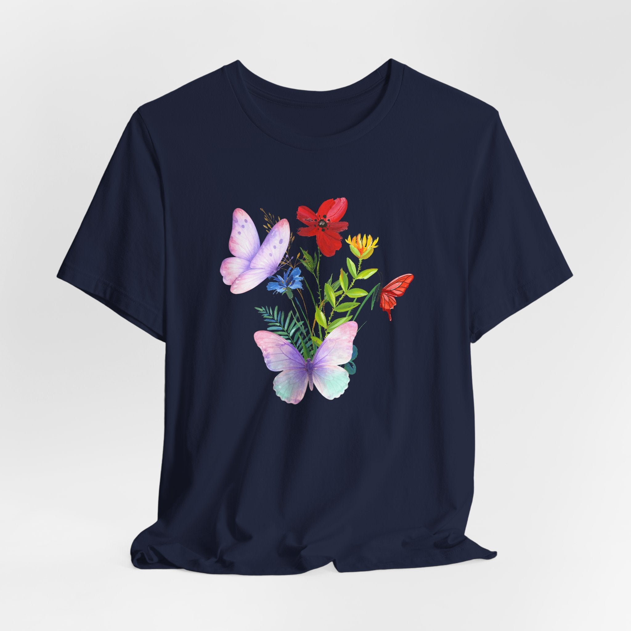 Navy blue t-shirt with butterfly and floral design on a light gray background