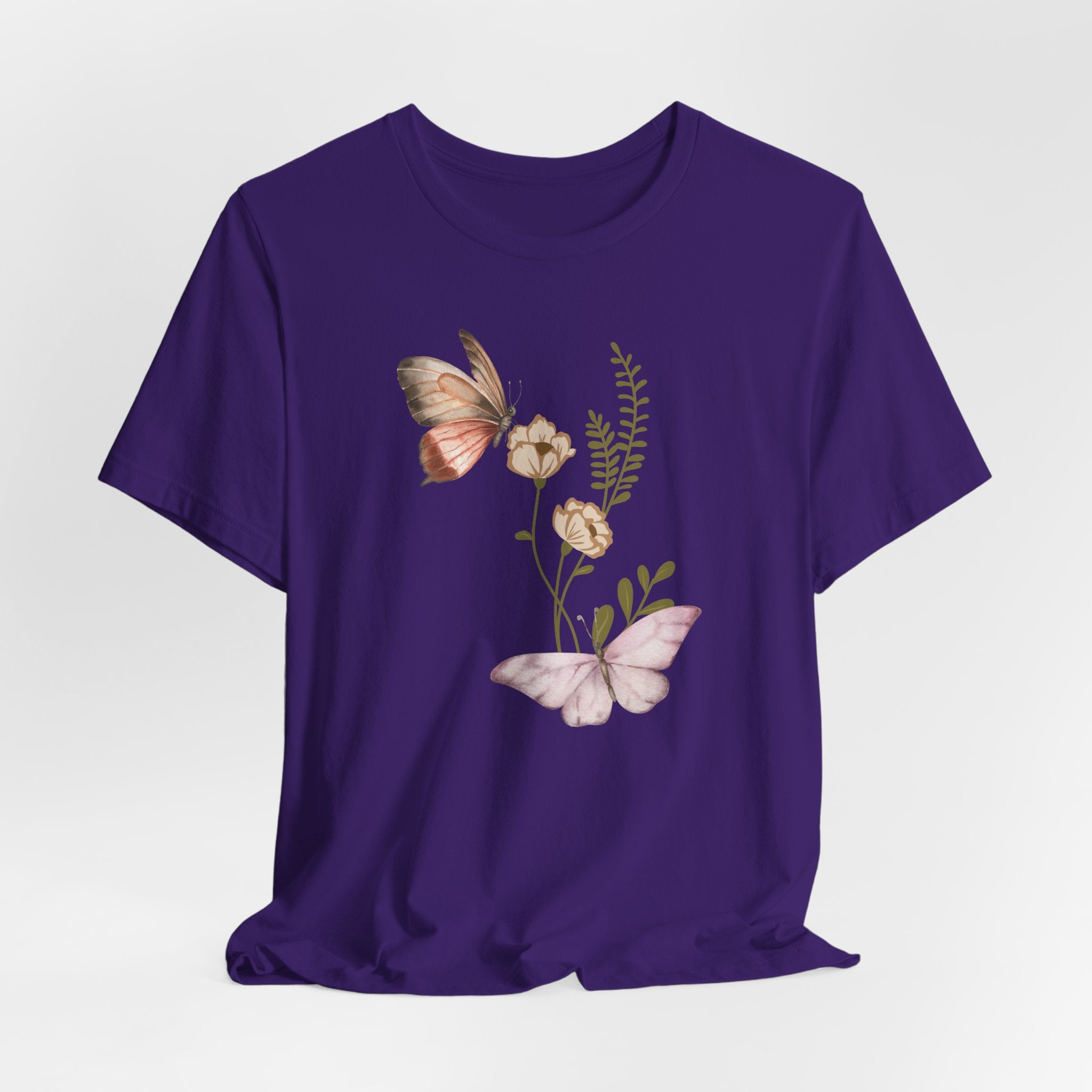 Purple t-shirt with butterfly and floral design on a white background