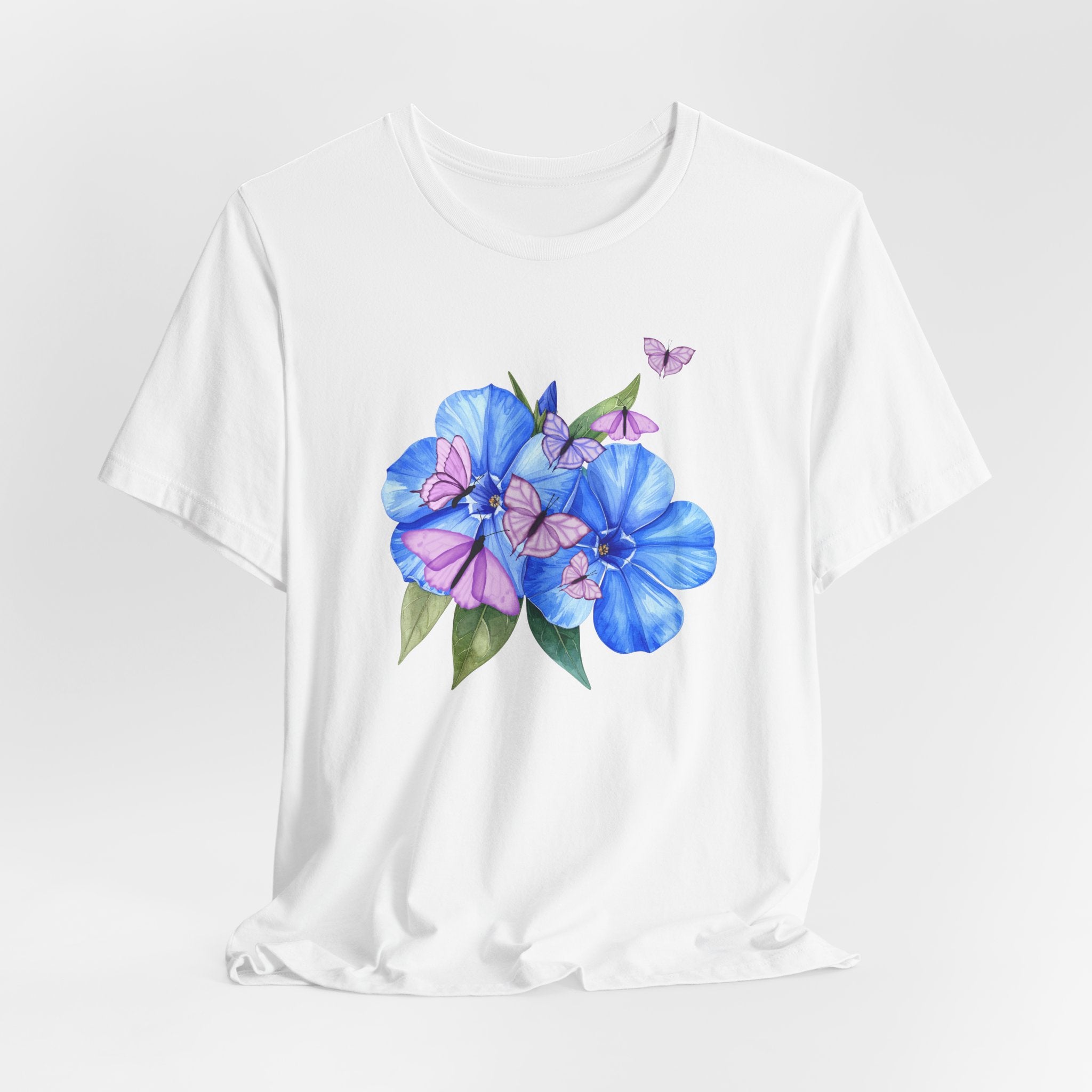 White t-shirt with blue and pink floral design on a white background
