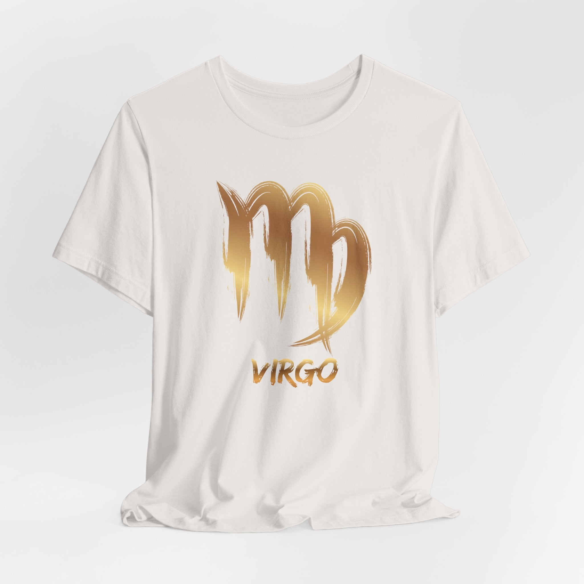 White t-shirt with gold 'Virgo' design on a light gray background