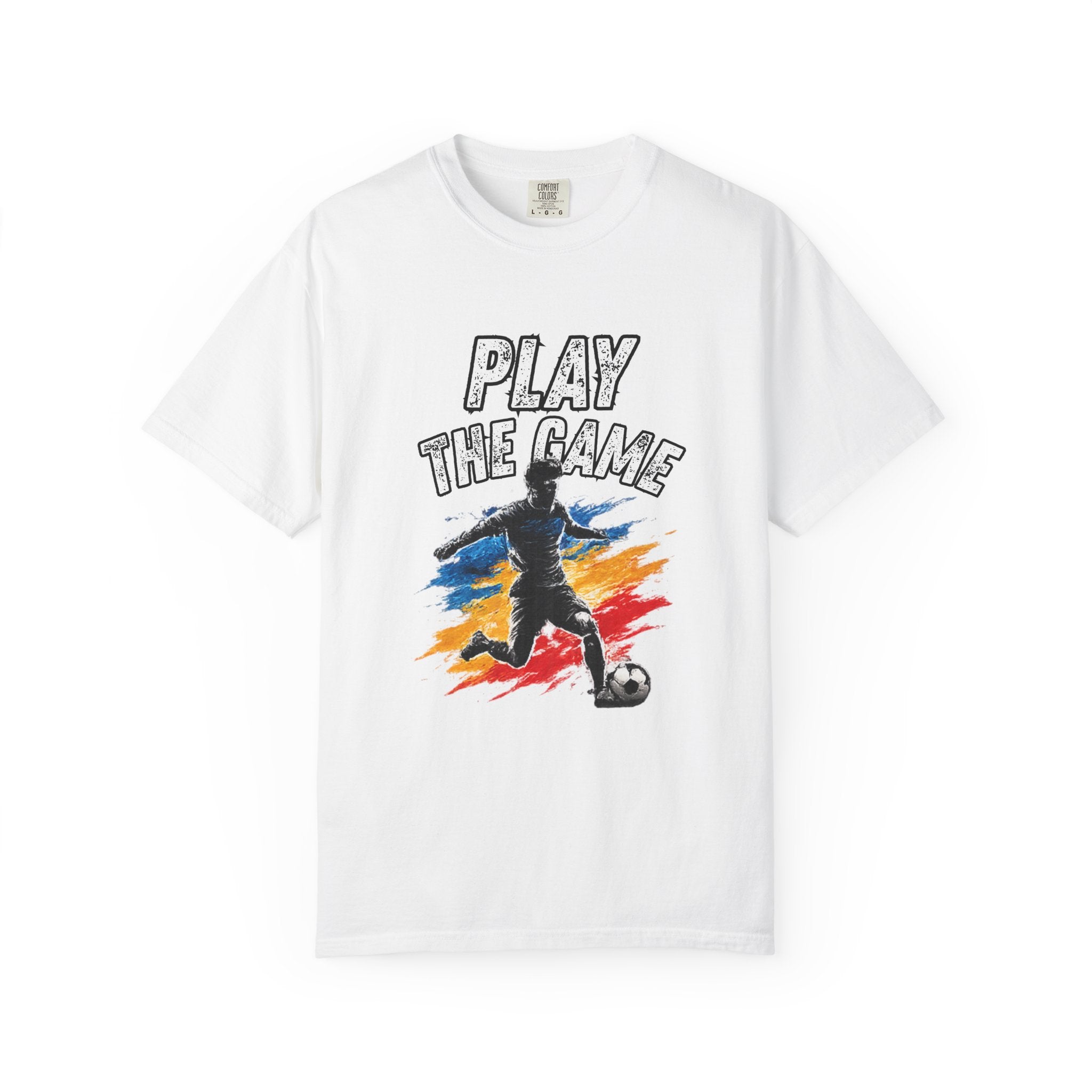 A white short-sleeve crewneck t-shirt featuring a graphic print of a soccer player kicking a ball with the text 'PLAY THE GAME' above, set against a clean white background.
