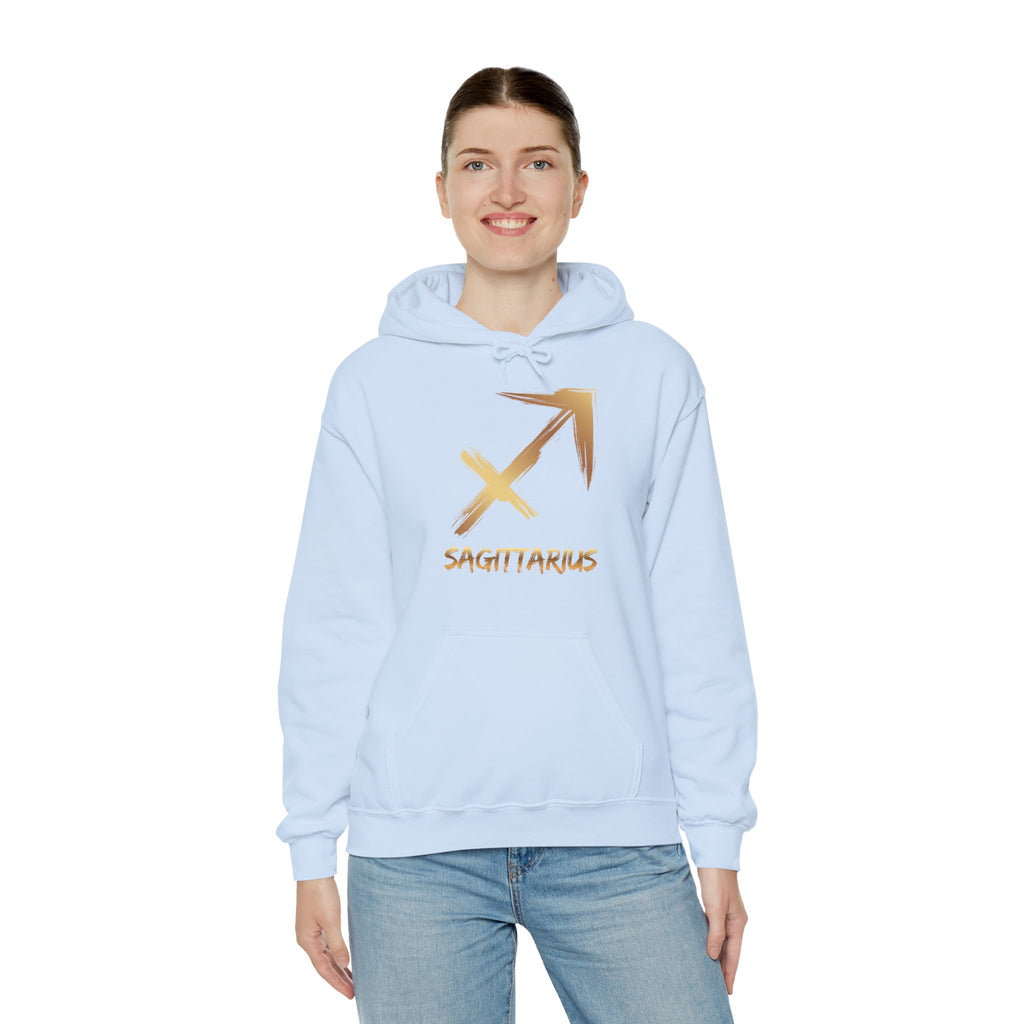 Person wearing a light blue hoodie with a gold Sagittarius symbol on a white background