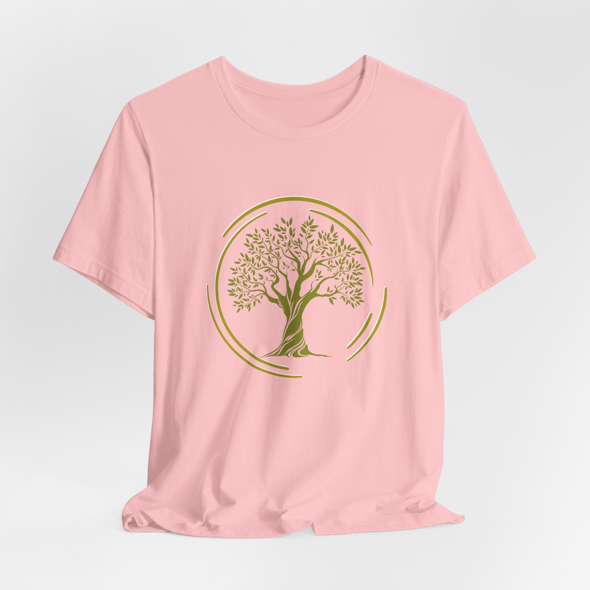 Pink t-shirt with a green tree design on a light gray background