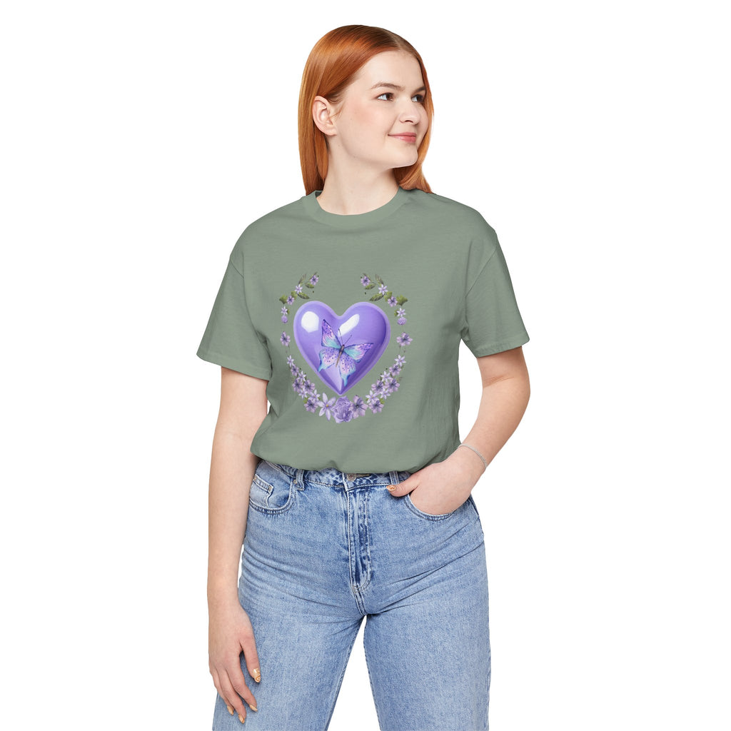 Person wearing a green t-shirt with a purple heart design on a white background