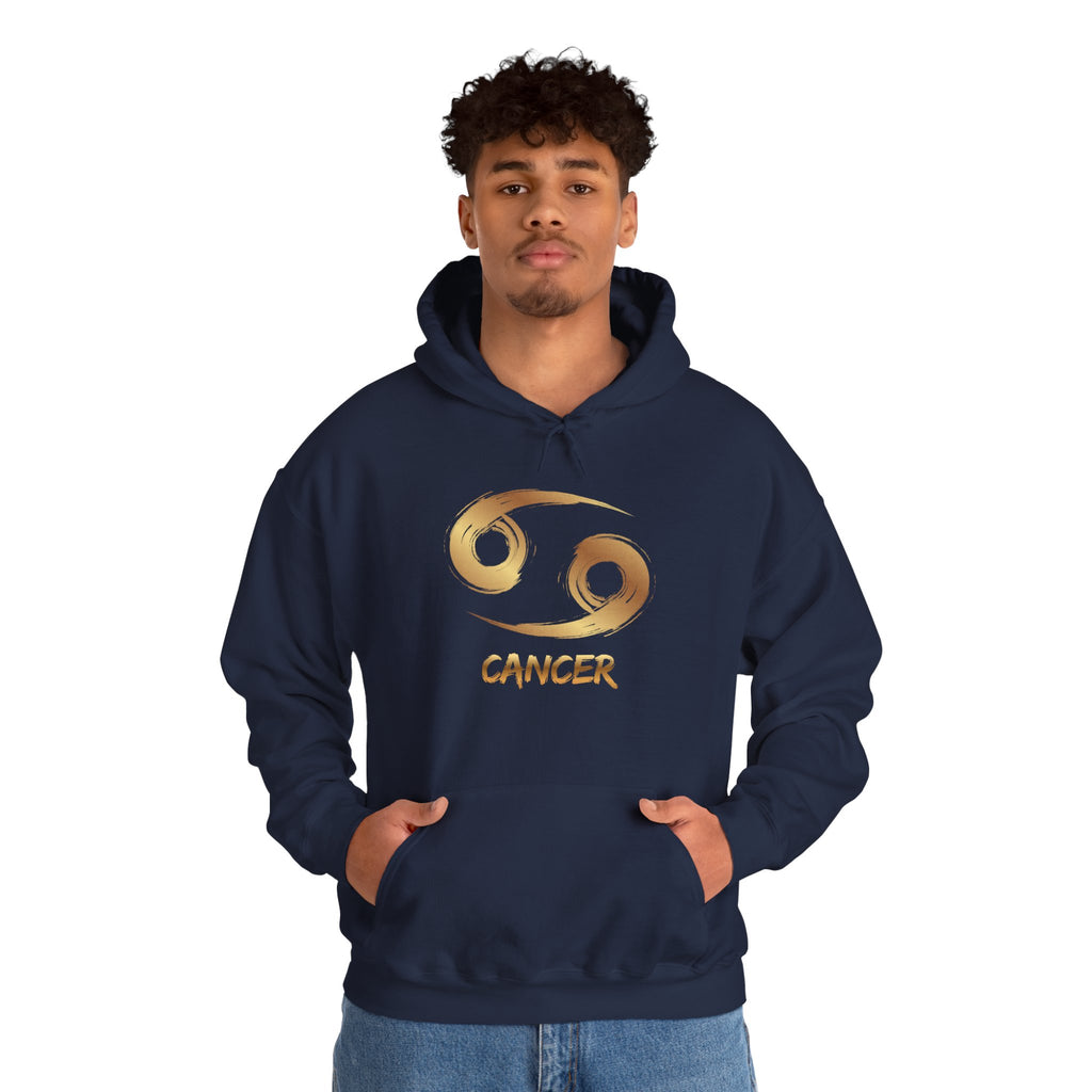 Person wearing a navy hoodie with 'Cancer' and zodiac symbol design on a white background