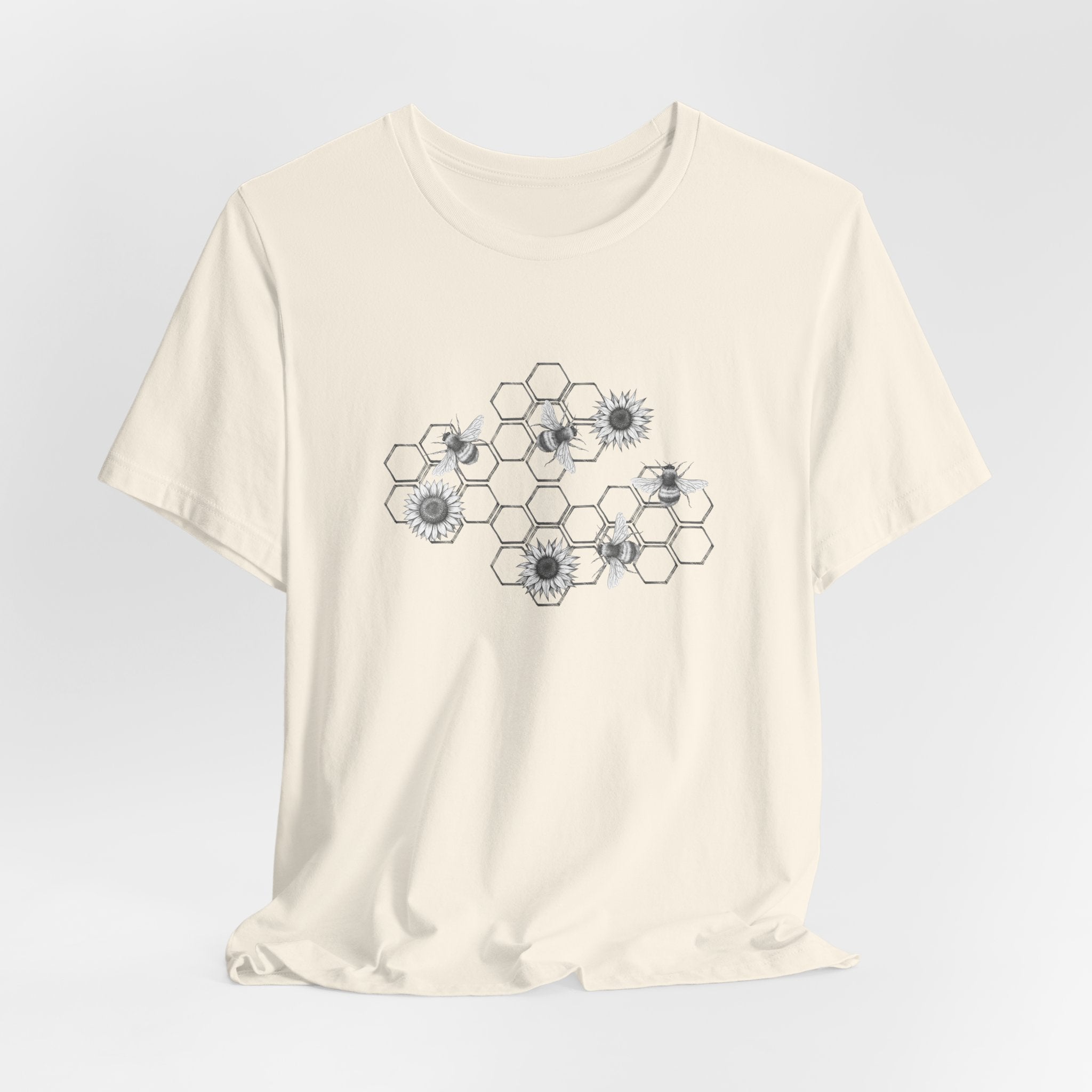 Beige t-shirt with geometric flower design on a light gray background