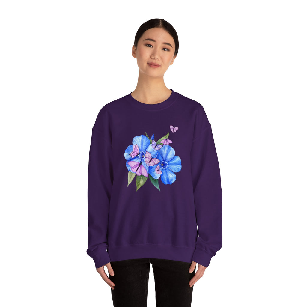 Person wearing a purple sweatshirt with a floral design on a white background