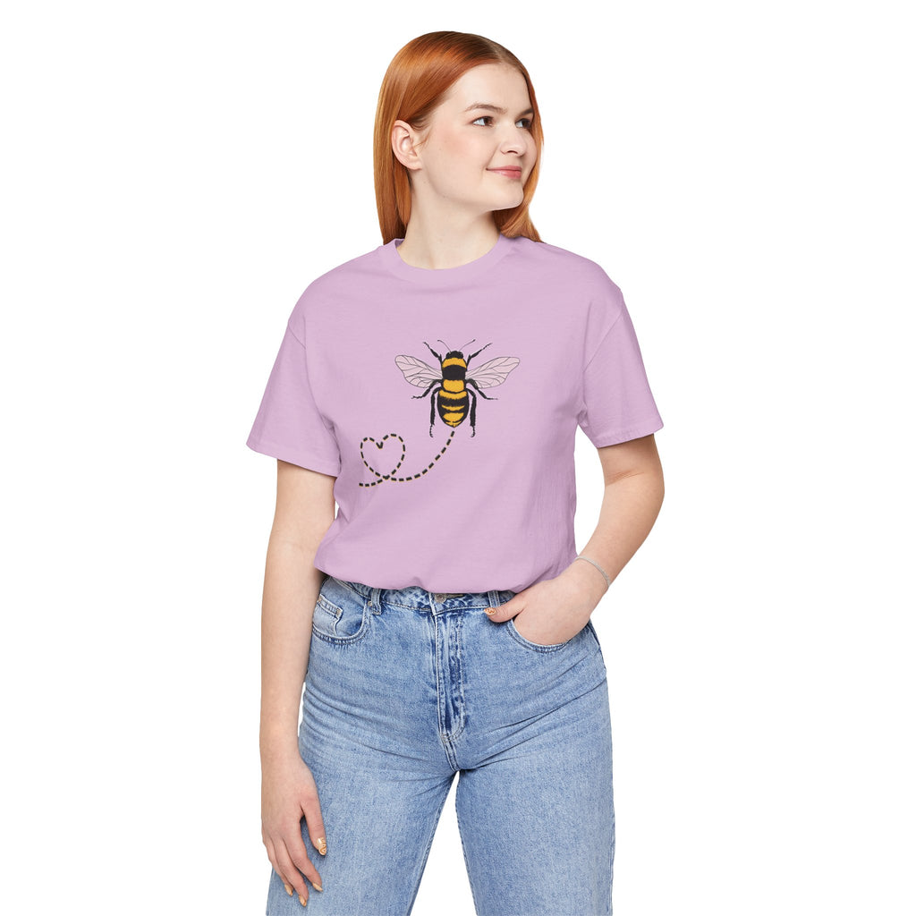 Person wearing a purple t-shirt with a bee design on a white background
