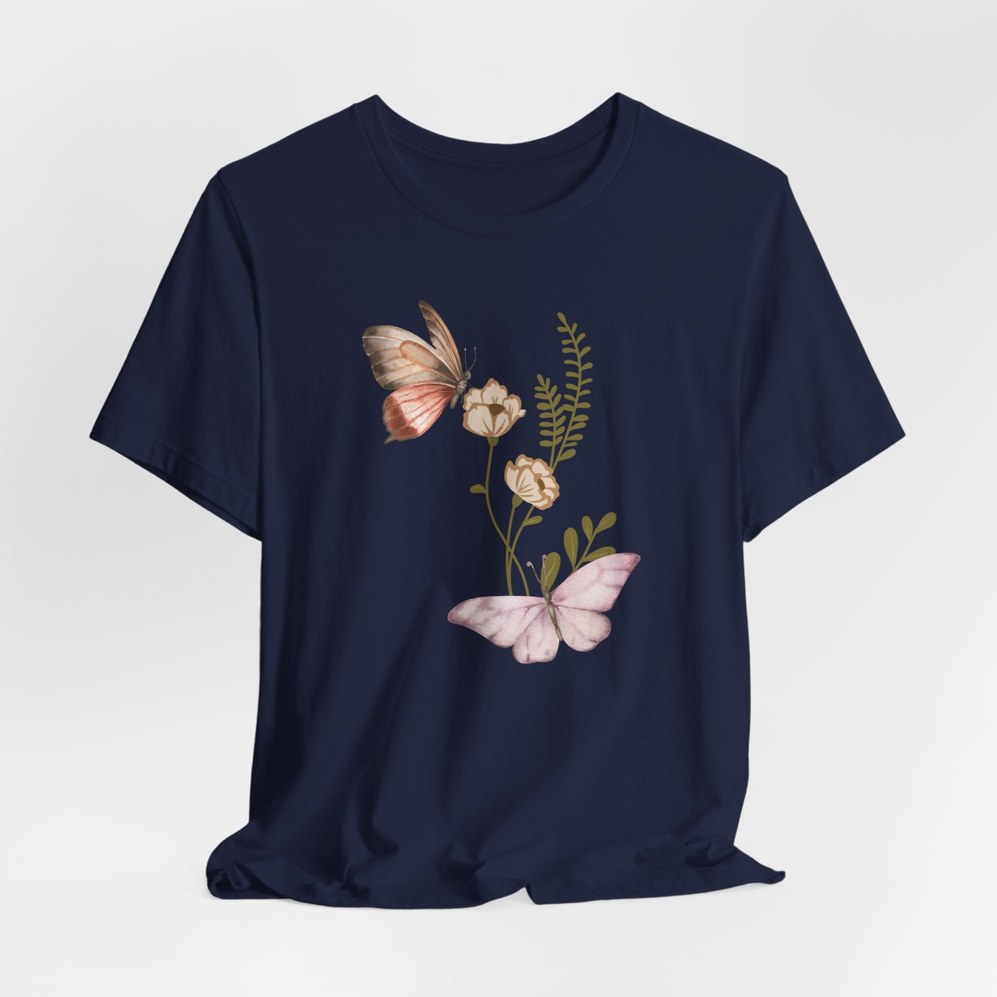 Navy blue t-shirt with butterfly and floral design on a light gray background