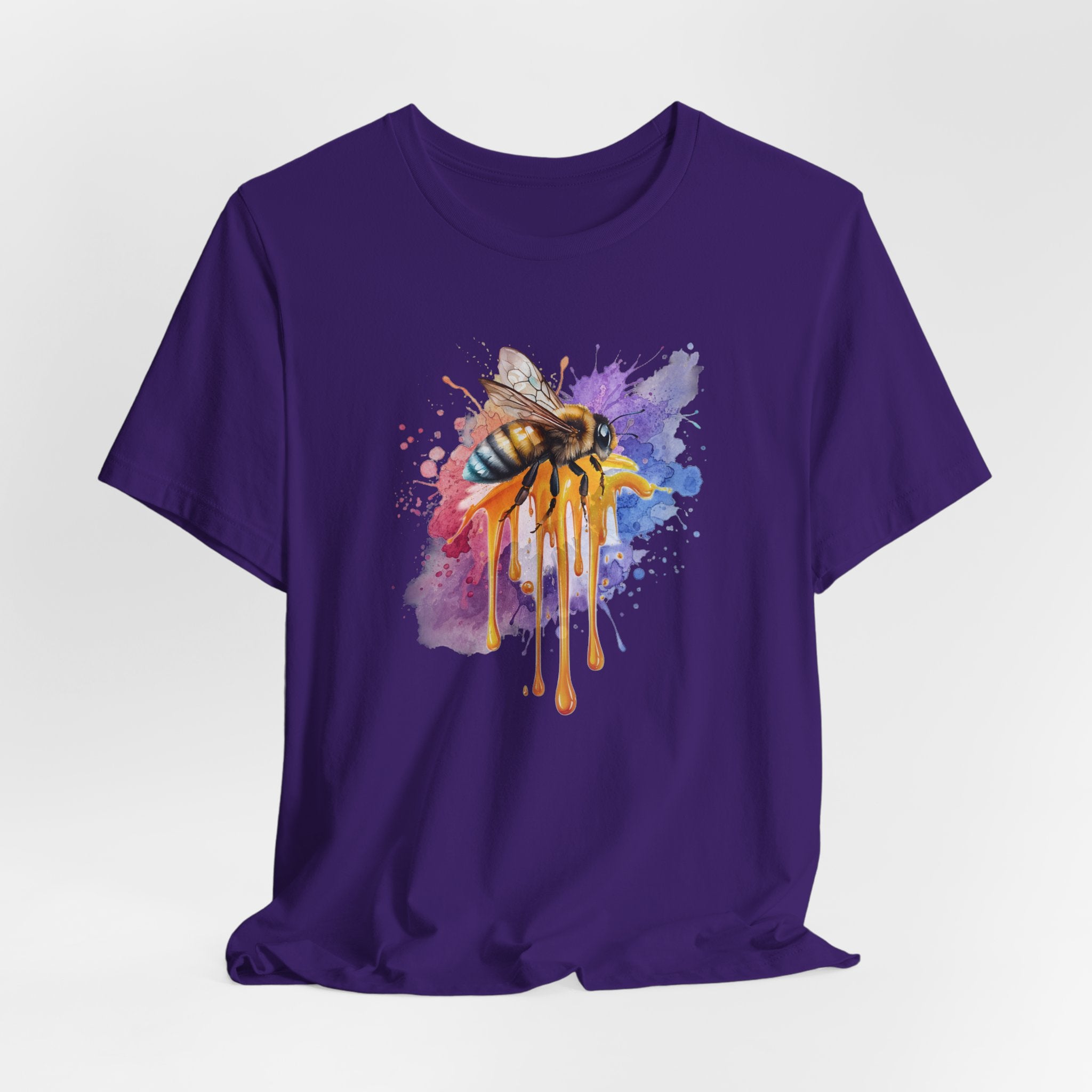 Purple t-shirt with a colorful bee design on a white background