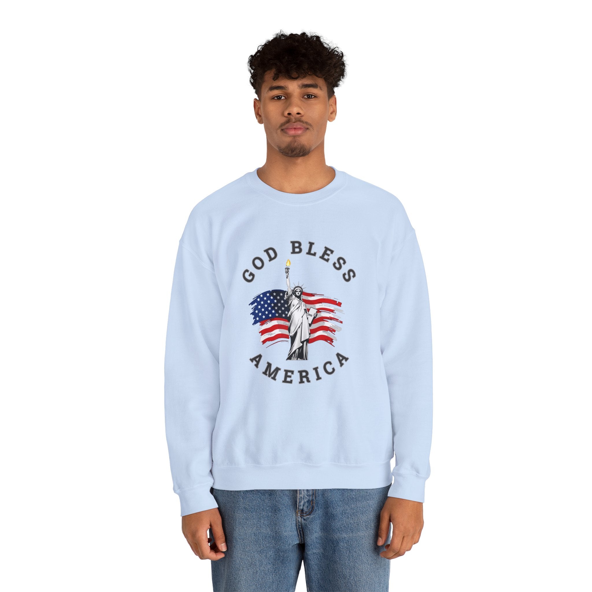 Person wearing a light blue sweatshirt with 'God Bless America' graphic on a white background