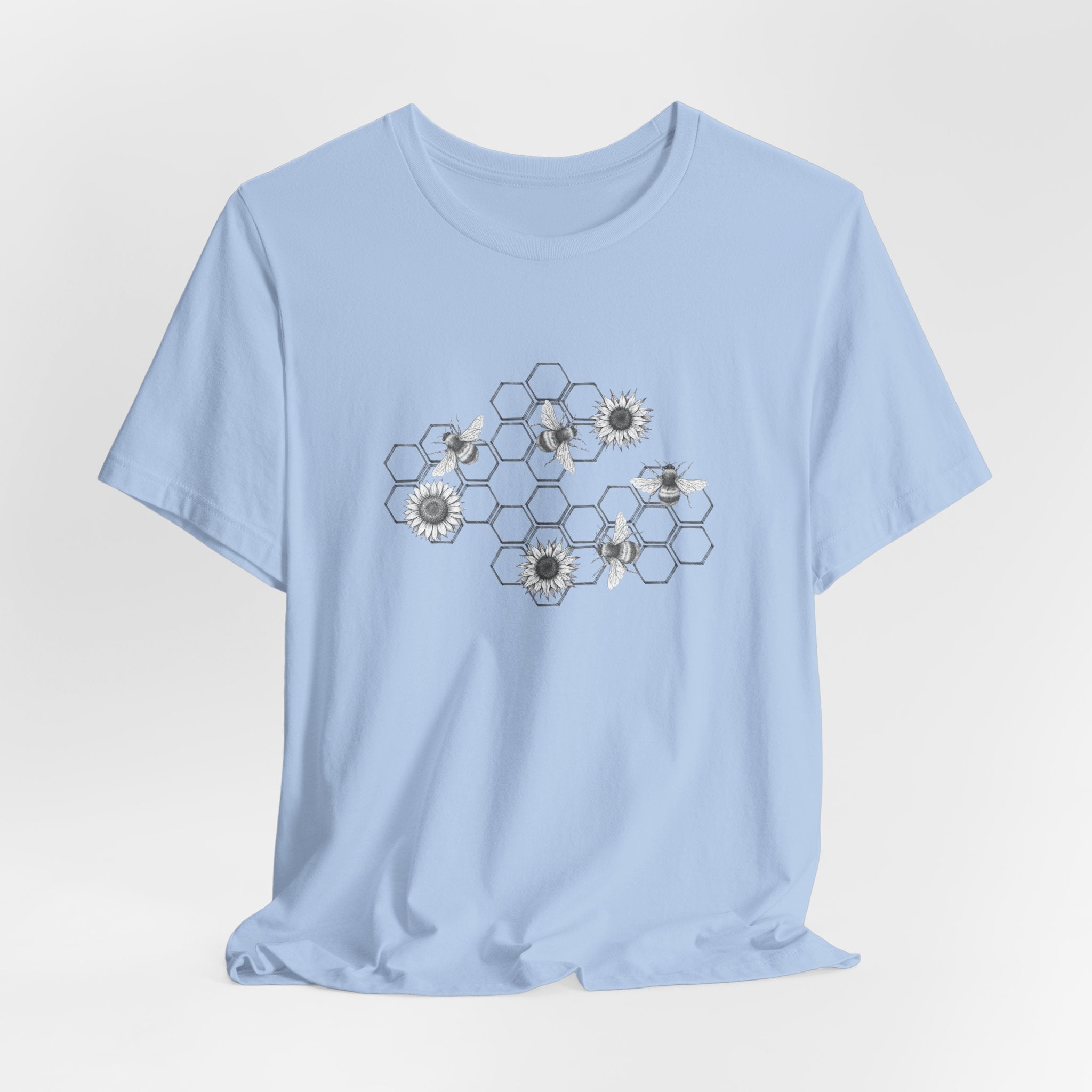 Light blue t-shirt with geometric floral design on a light gray background