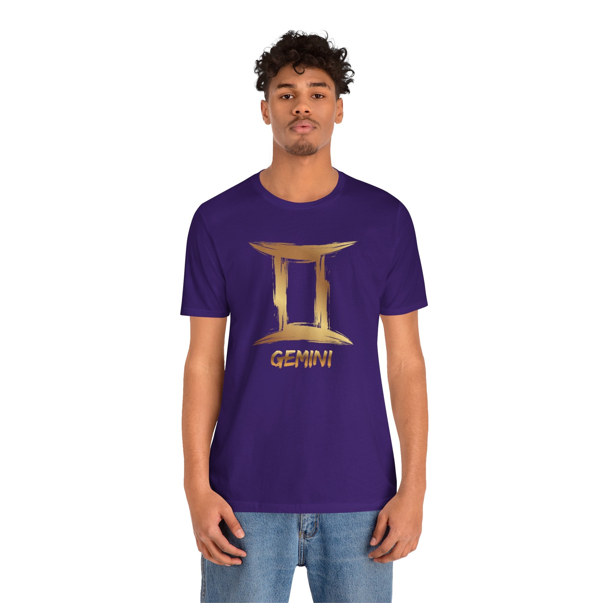 Person wearing a purple t-shirt with Gemini symbol design on a white background