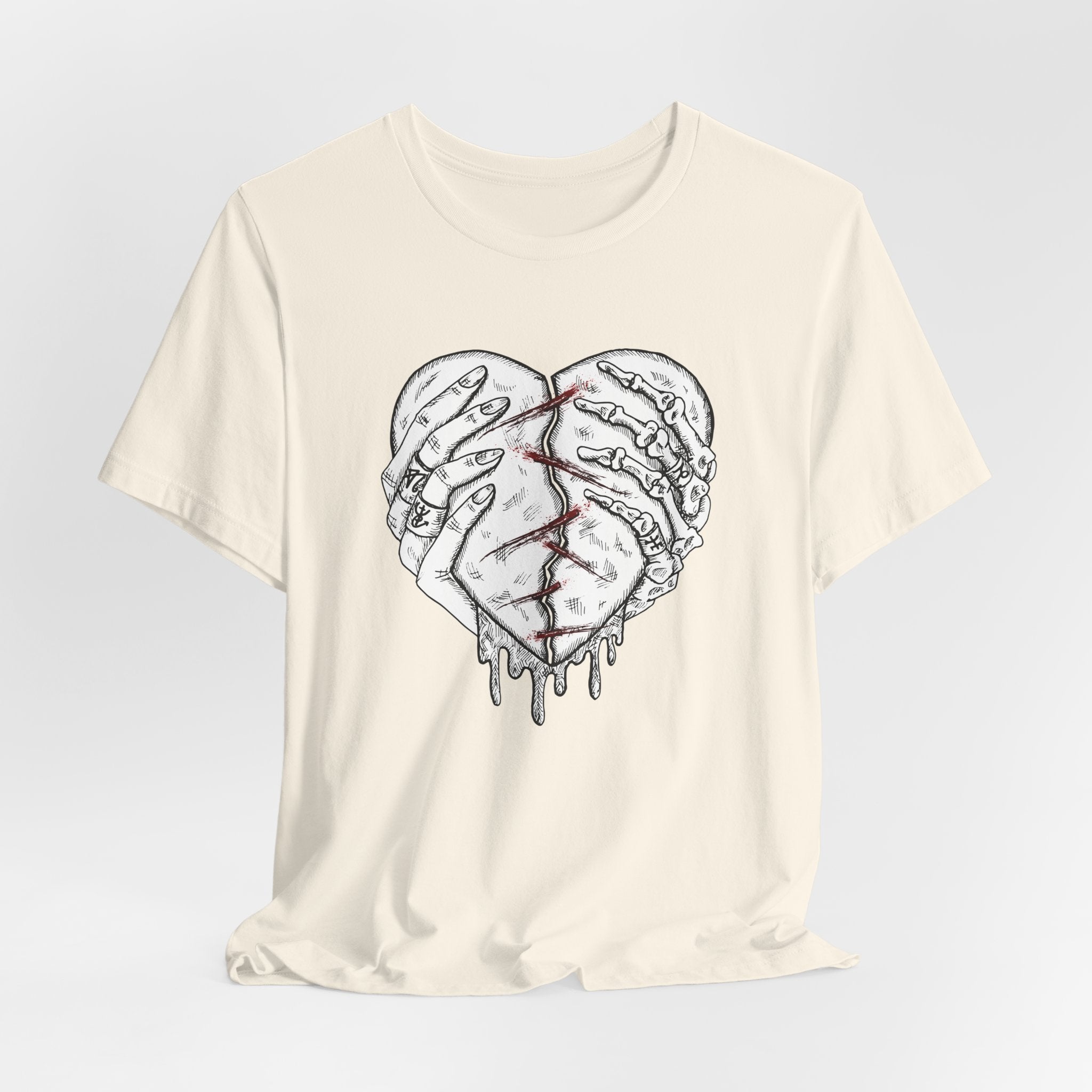 White t-shirt with a graphic design of a heart made of hands on a light gray background