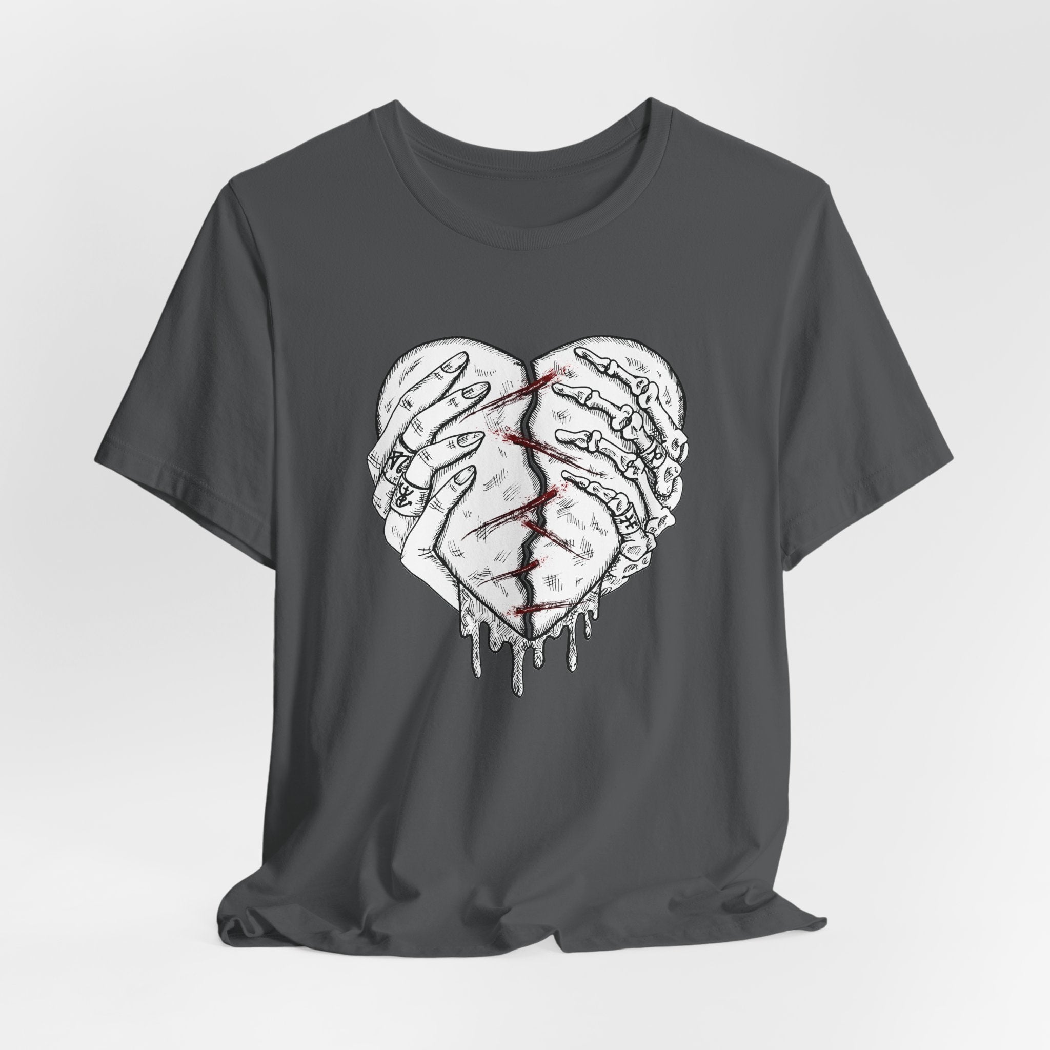 Black t-shirt with a graphic design of two hands holding a heart on a white background