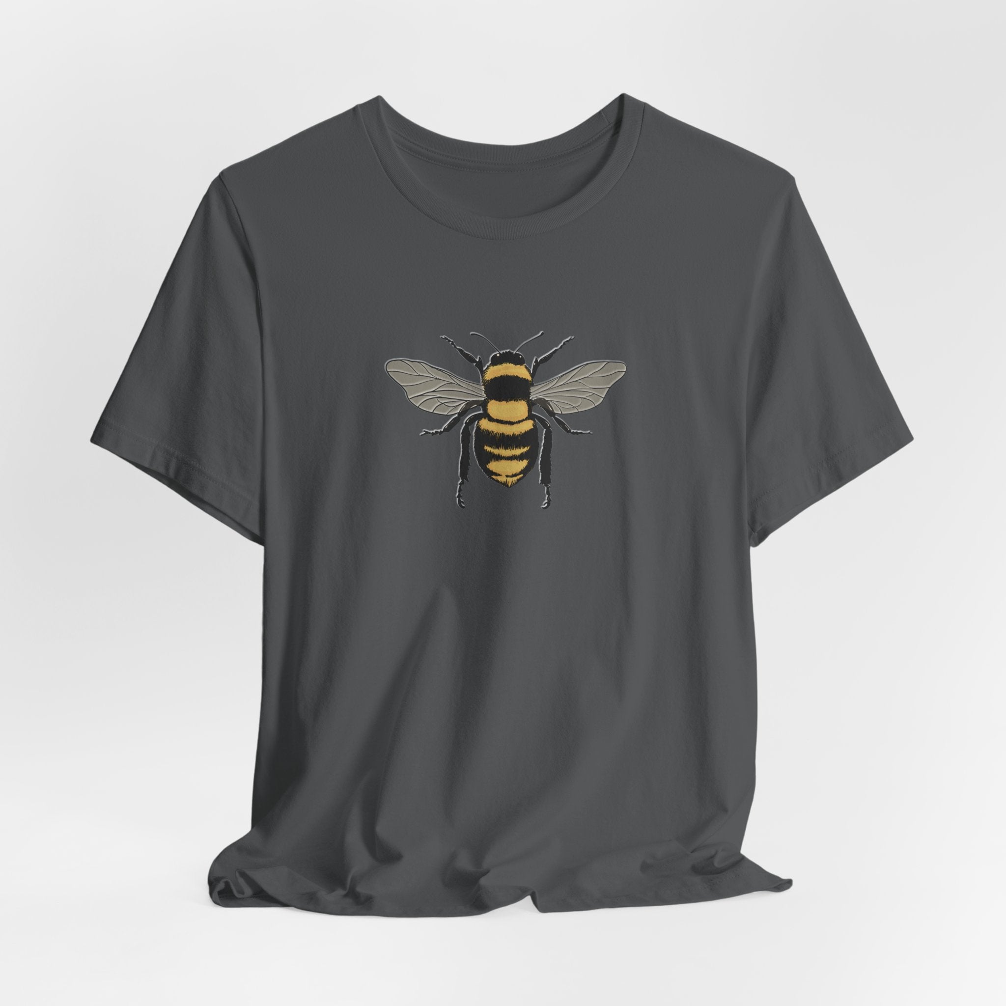 Gray t-shirt with a bee design on a light gray background