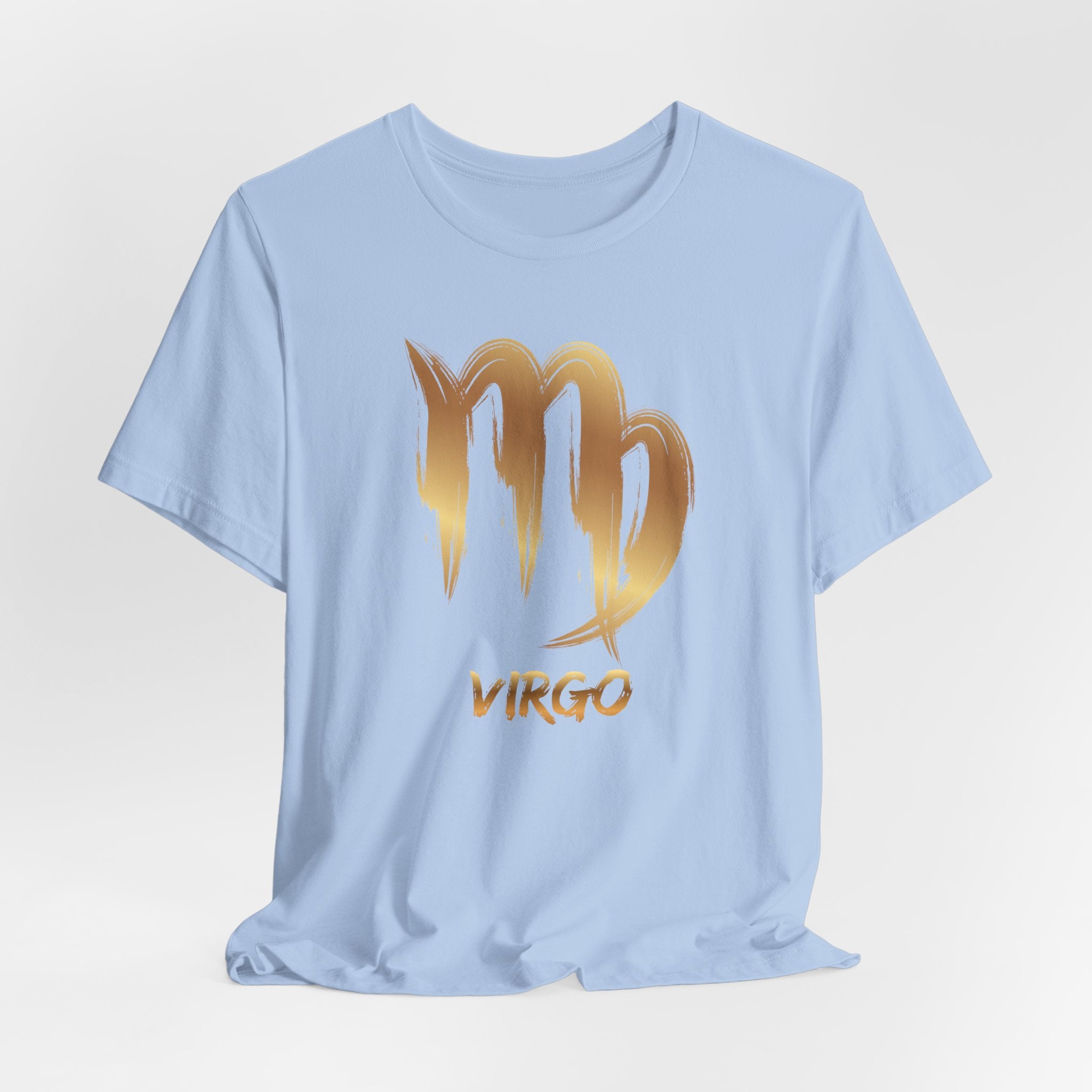 Light blue t-shirt with gold Virgo zodiac sign on a light gray background