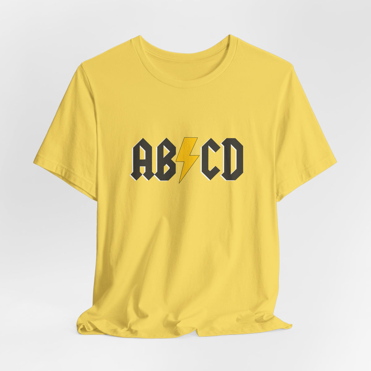 Yellow t-shirt with 'ABCD' design on a white background
