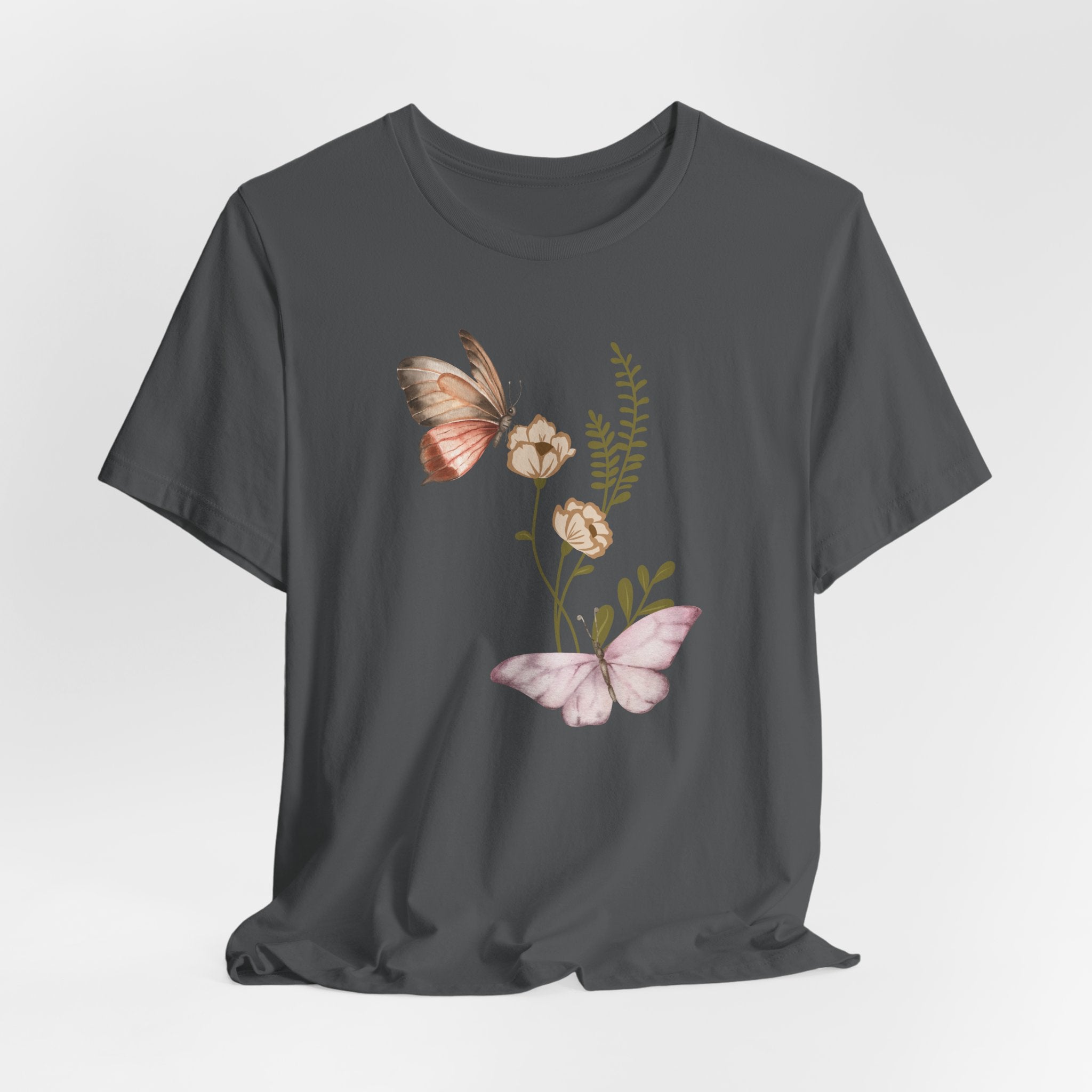 Dark gray t-shirt with butterfly and floral design on a light gray background