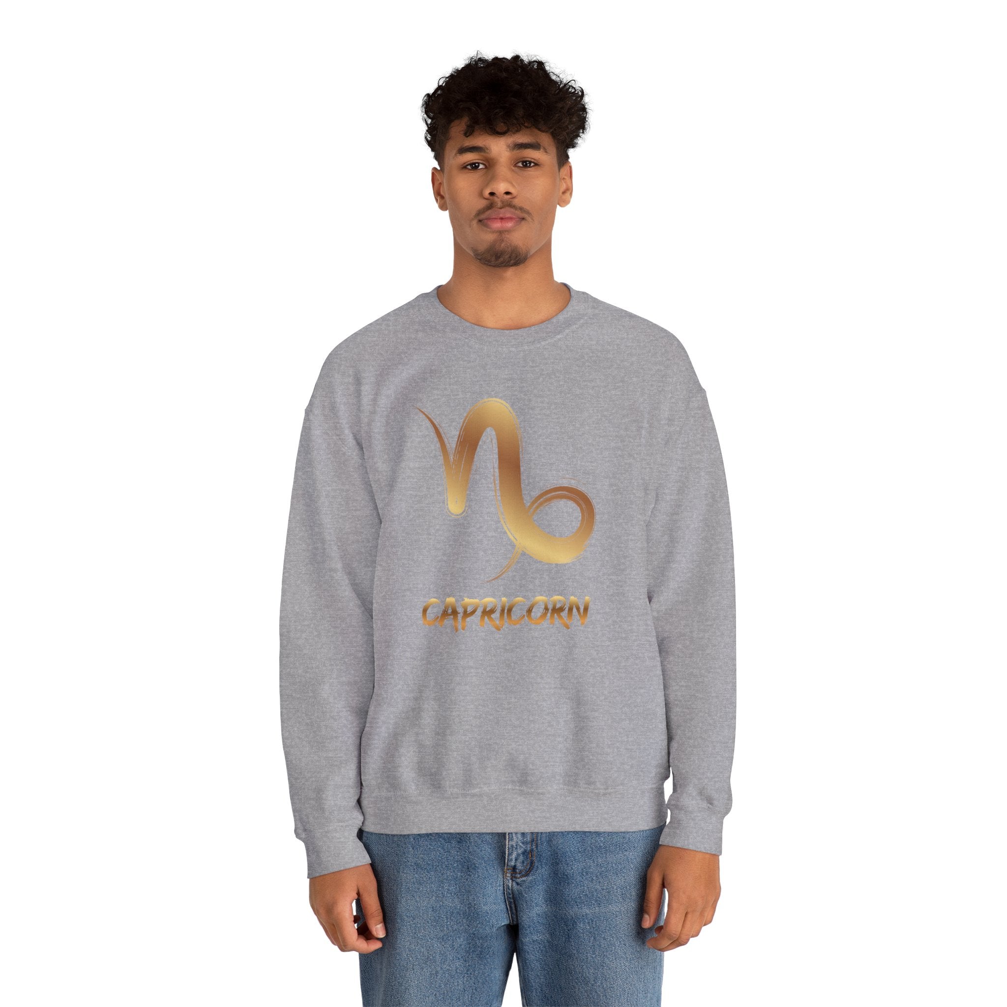 Person wearing a gray sweatshirt with Capricorn symbol and text on a white background