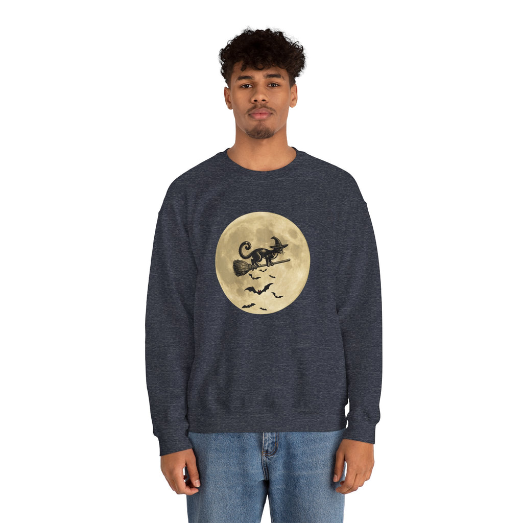 Person wearing a navy blue sweatshirt with a Halloween design of a cat on a moon and bats on a white background