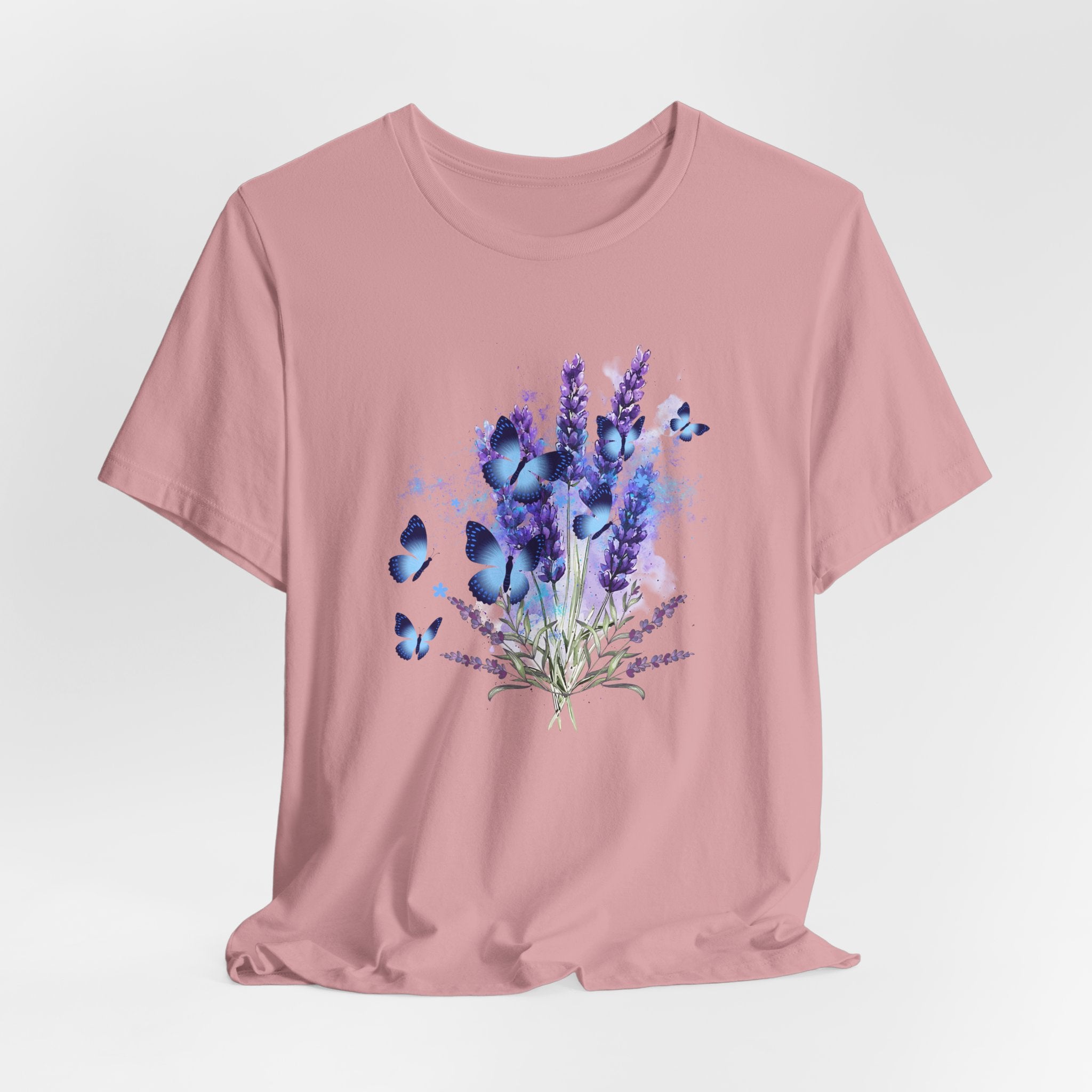 Pink t-shirt with a design of lavender flowers and butterflies on a light gray background