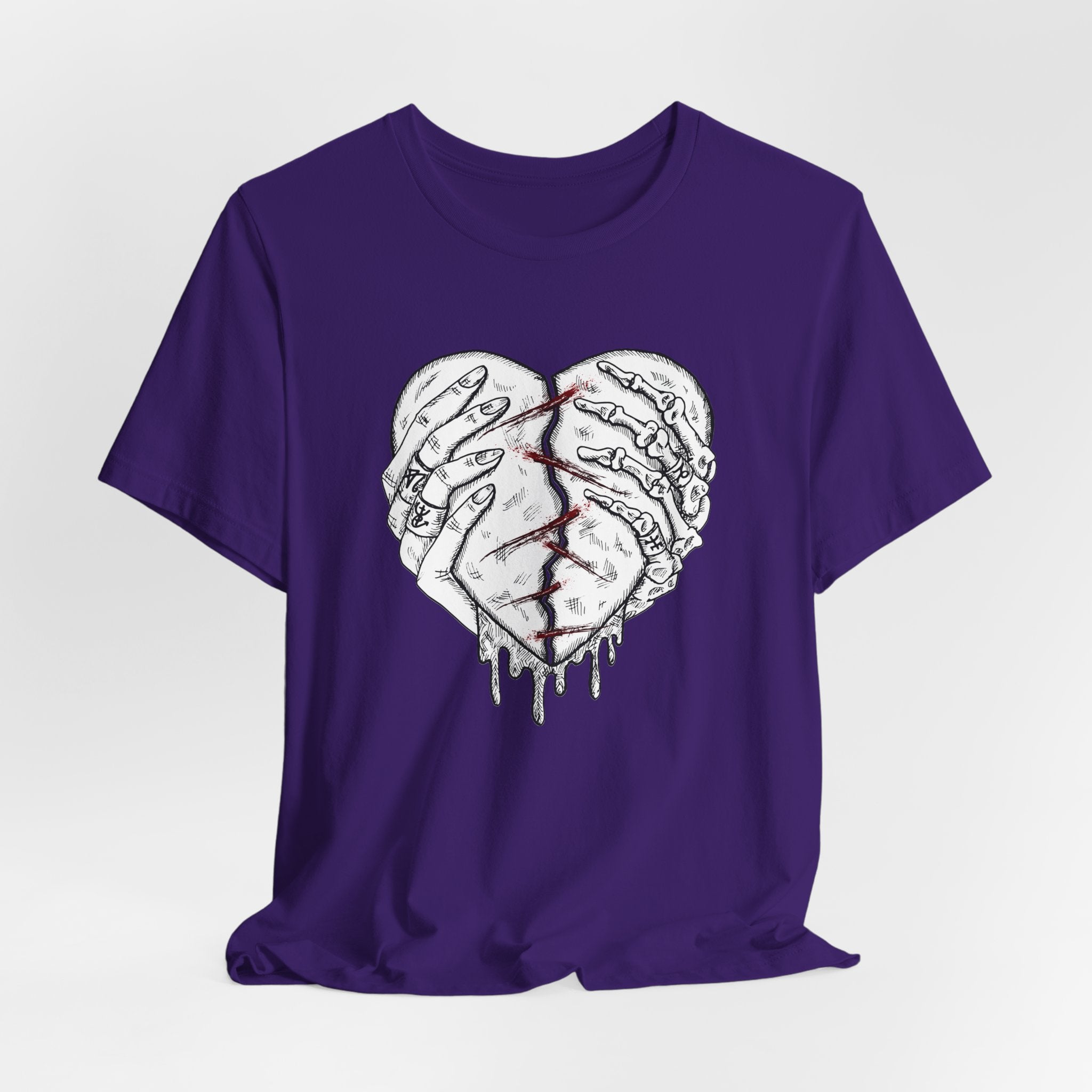 Purple t-shirt with a graphic design of two hands forming a heart on a white background