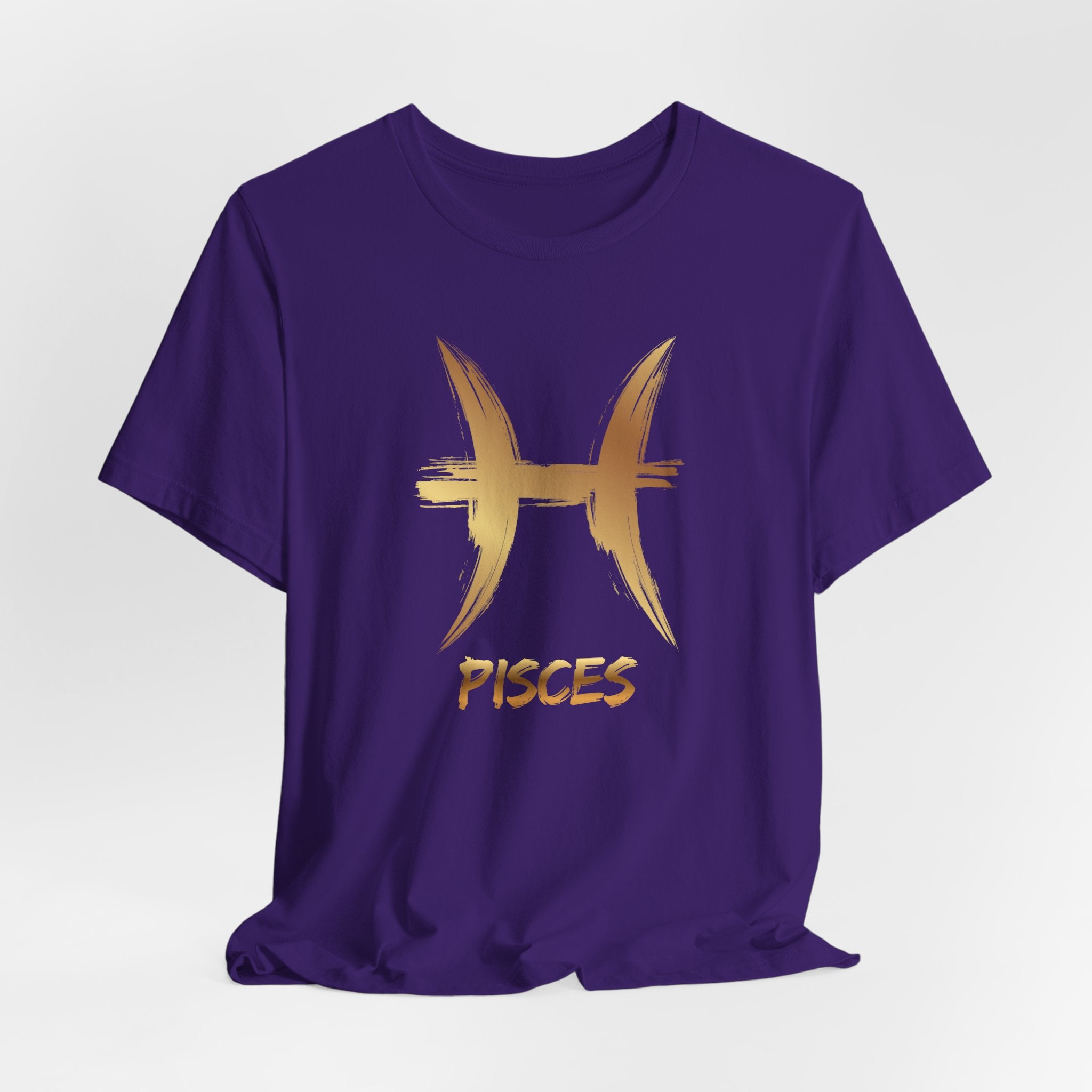 Purple t-shirt with gold Pisces symbol and text on a white background