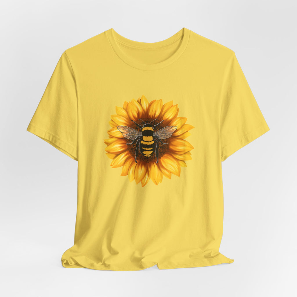 Yellow t-shirt with a sunflower and bee design on a white background
