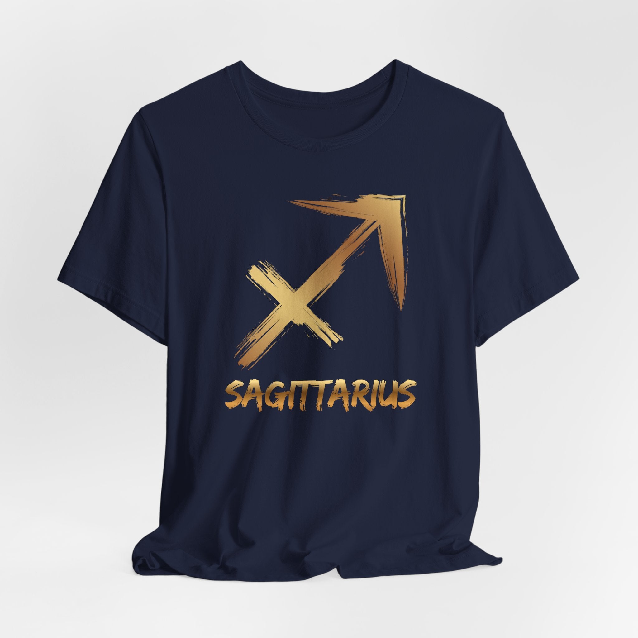 Navy blue t-shirt with gold Sagittarius zodiac symbol on a light gray background
