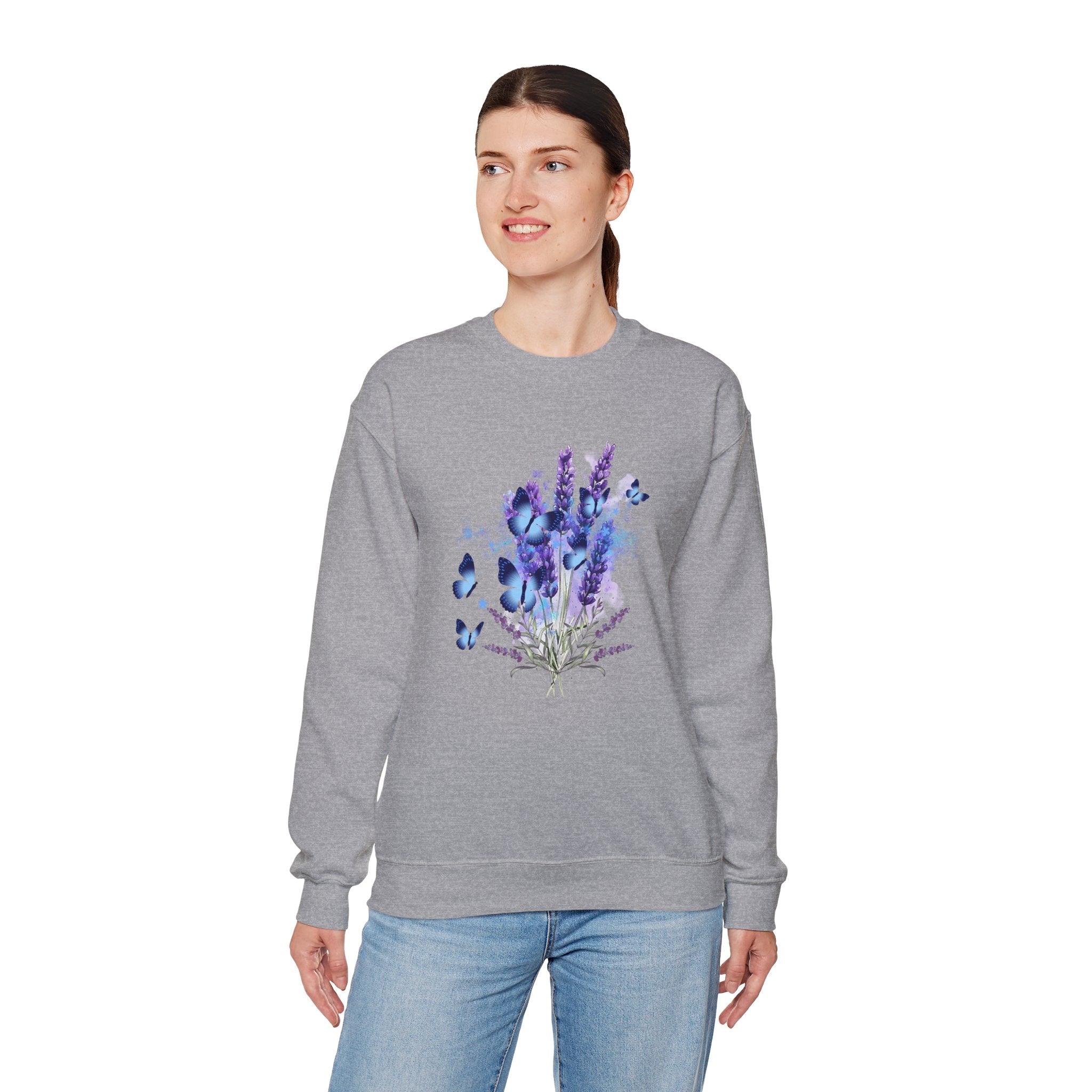 Woman wearing a gray sweatshirt with a design of lavender flowers and butterflies on a white background