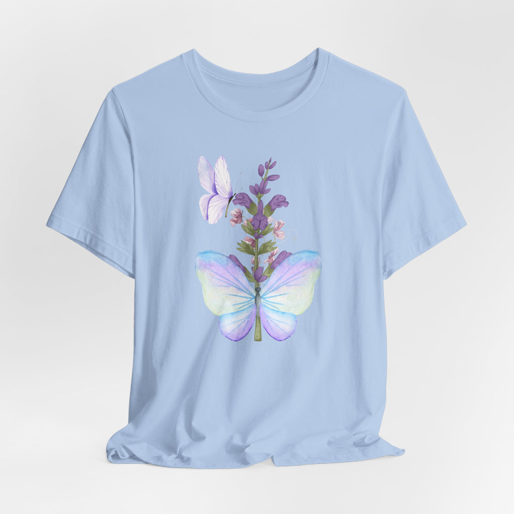 Light blue t-shirt with a colorful butterfly and floral design on a light gray background