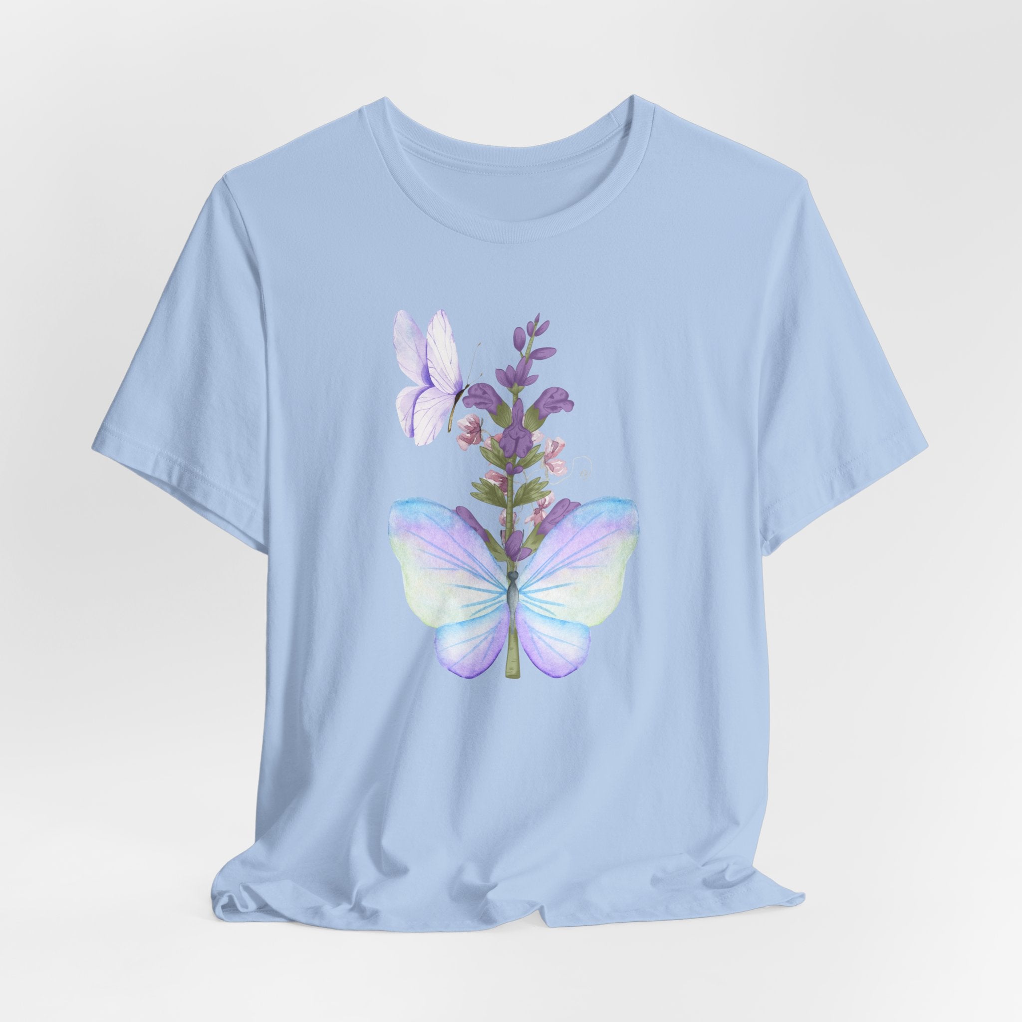 Light blue t-shirt with a colorful butterfly and floral design on a light gray background