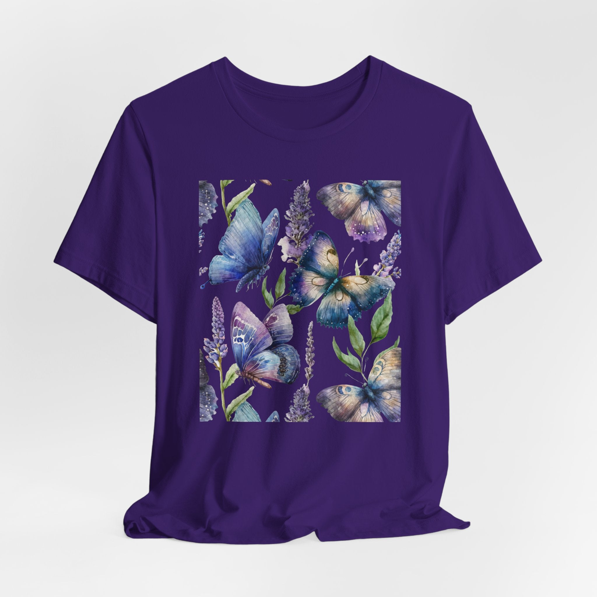 Purple t-shirt with butterfly and floral design on a light gray background