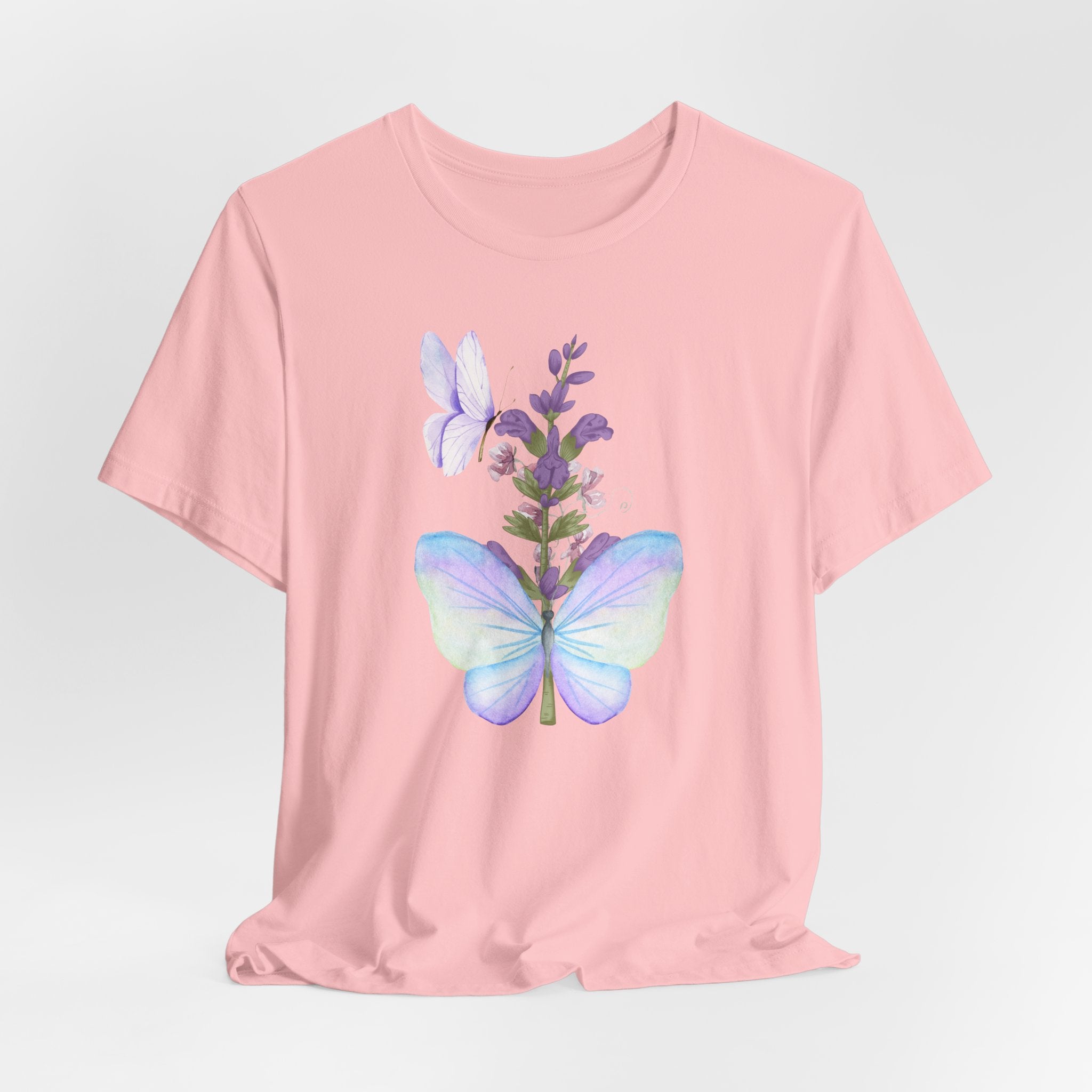 Pink t-shirt with butterfly and lavender design on a light gray background