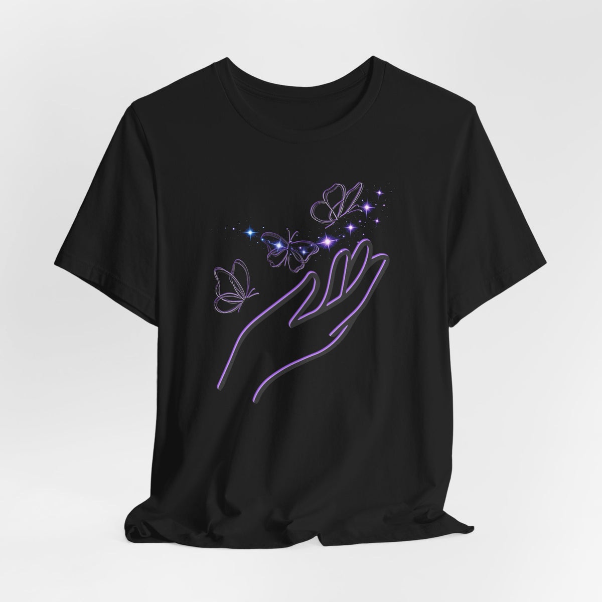 Black t-shirt with a hand and butterfly design on a light gray background