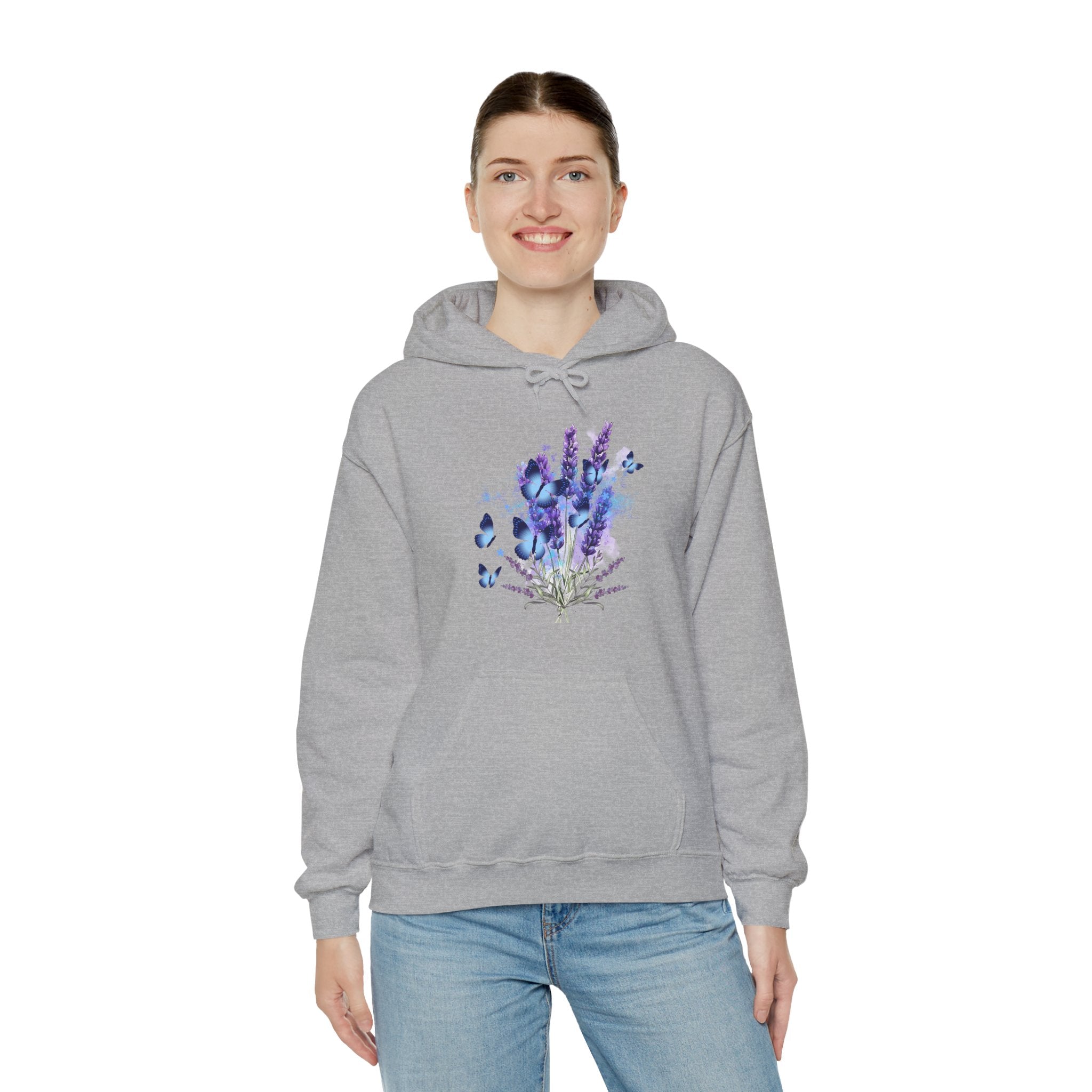 Person wearing a gray hoodie with a colorful floral design on a white background