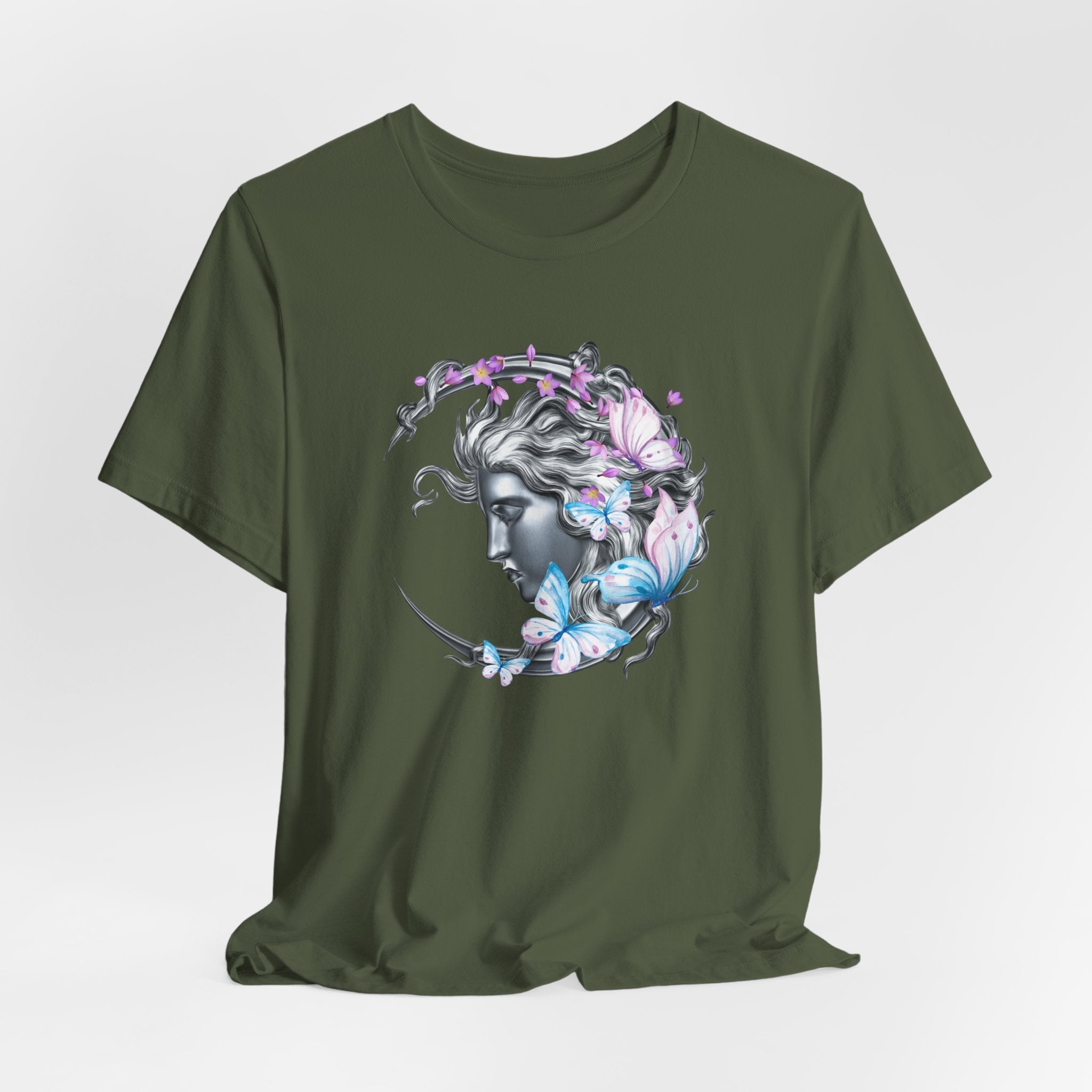 Green t-shirt with a decorative design featuring flowers and butterflies on a white background