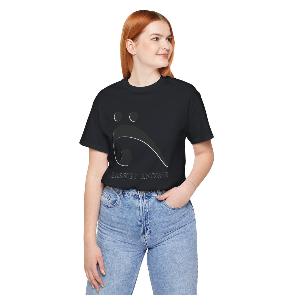 Person wearing a black t-shirt with black bass clef and 'Bassist Knows' text on a light gray background
