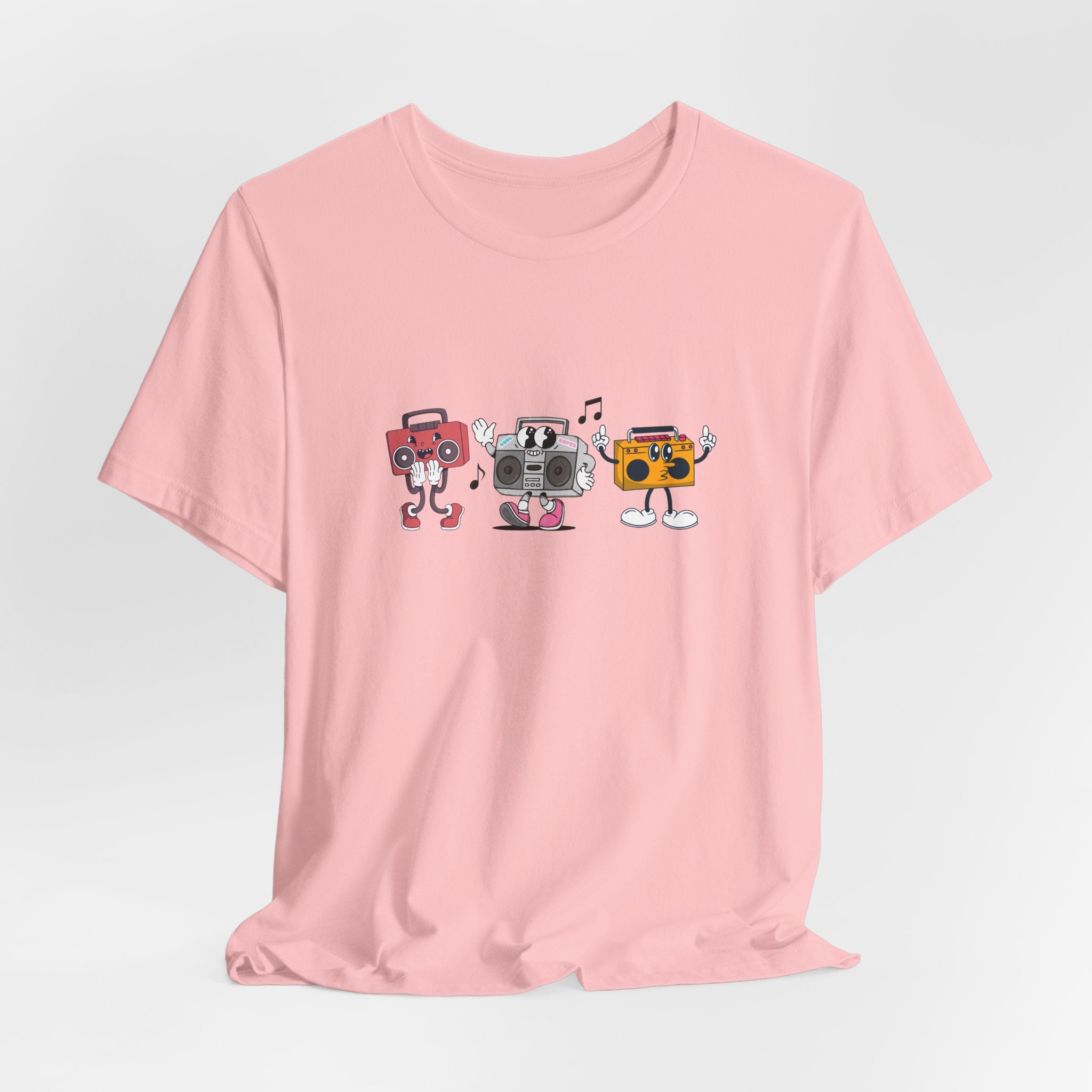 Pink t-shirt with cartoon boombox design on a light gray background