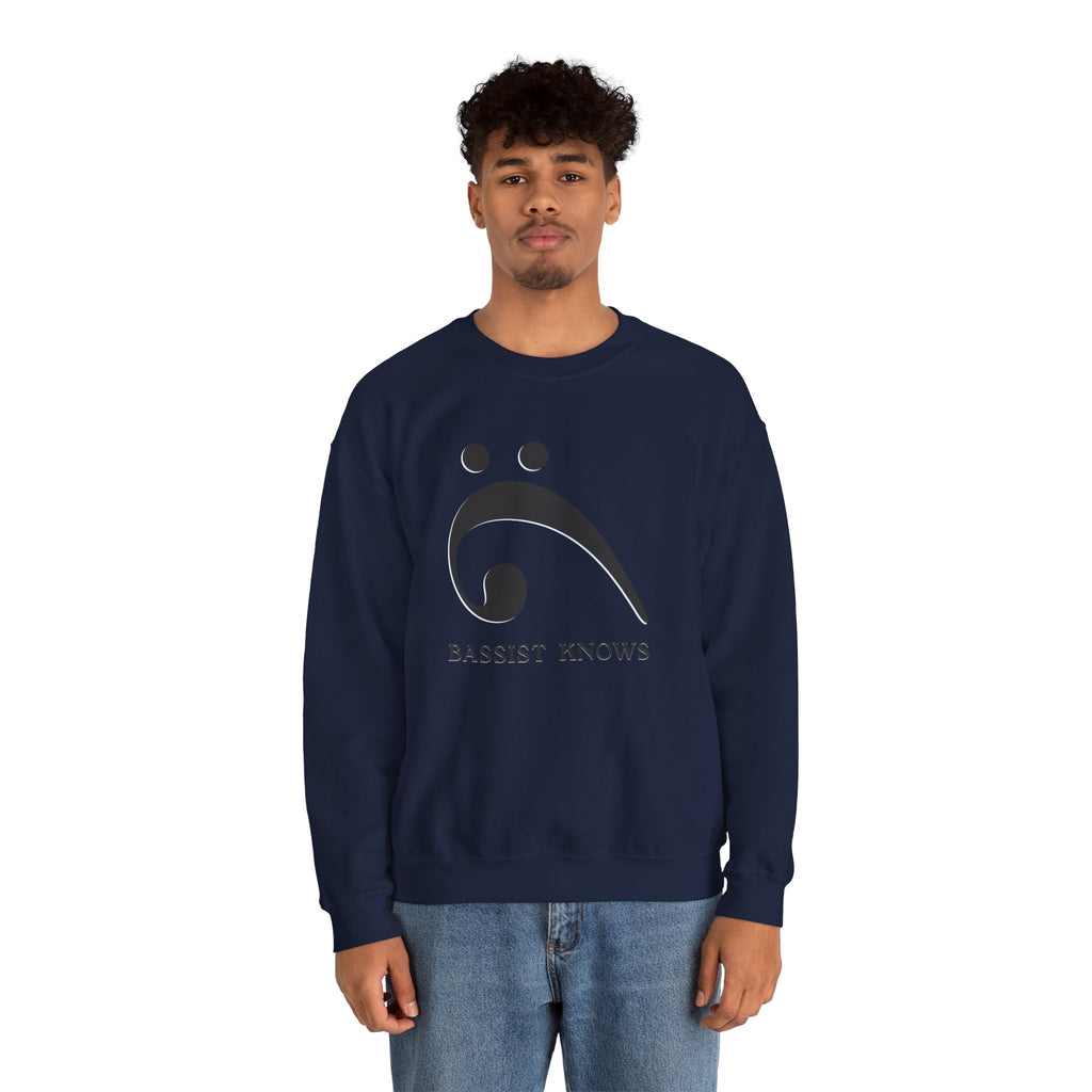 Person wearing a navy blue sweatshirt with a black bass clef graphic and "Bassist Knows" text on a white background