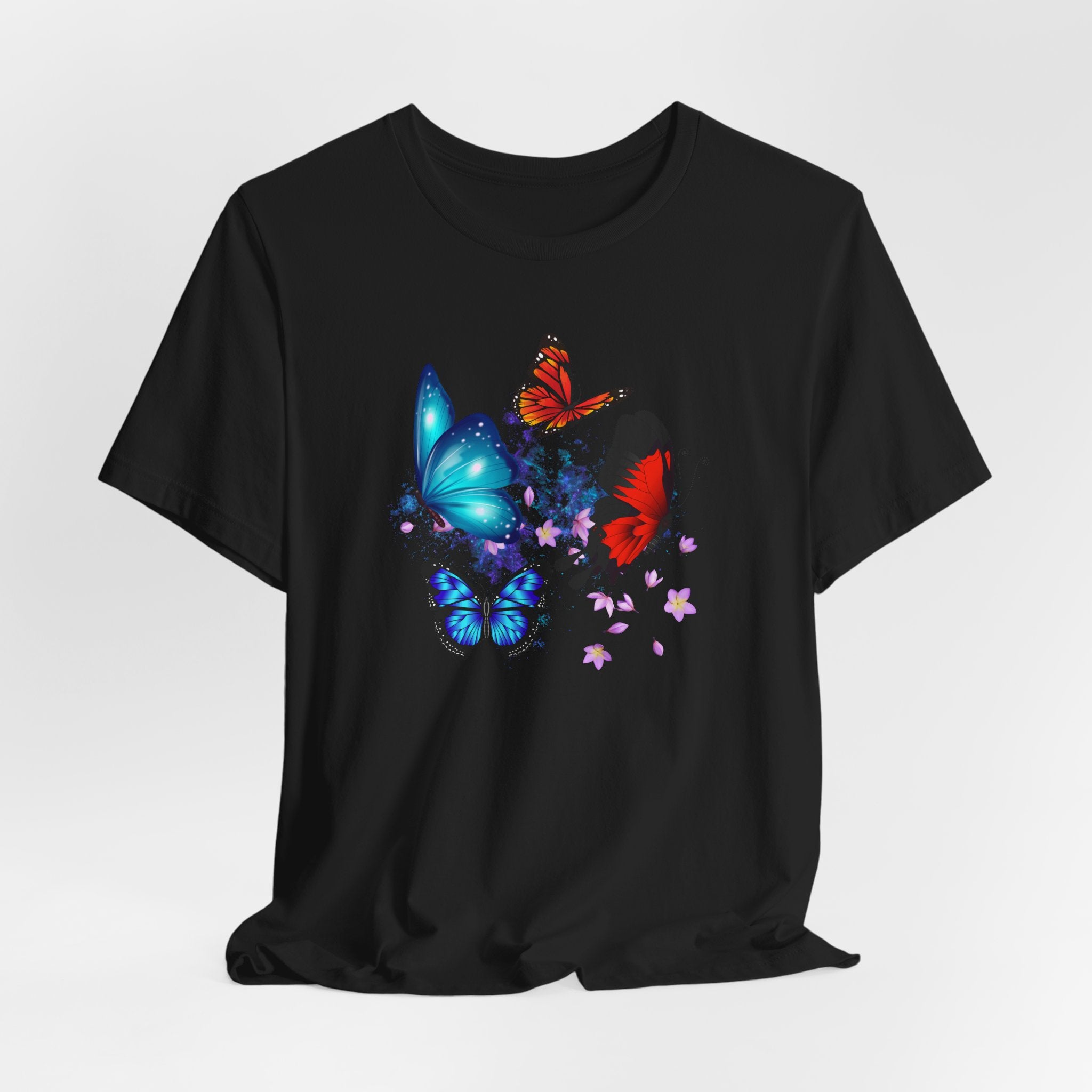 Black t-shirt with colorful butterfly design on a white background
