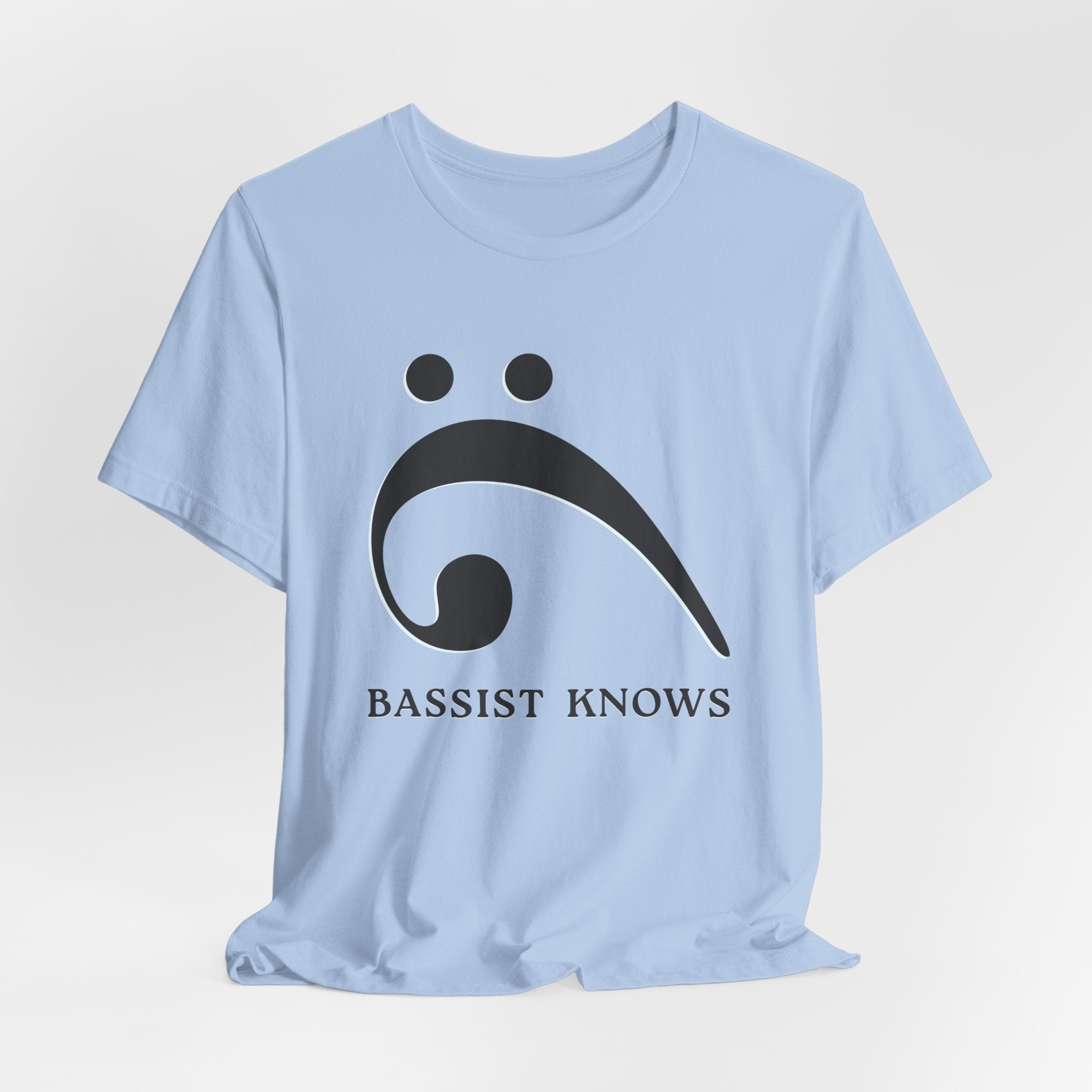 Light blue t-shirt with black bass clef and 'Bassist Knows' text on a light gray background