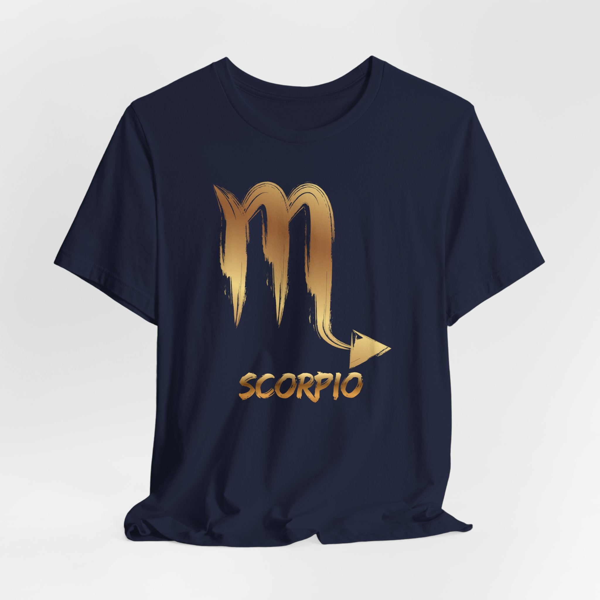 Navy blue t-shirt with gold Scorpio zodiac symbol on a light gray background