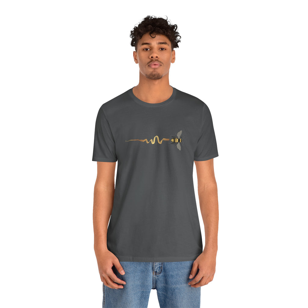 Person wearing a dark gray t-shirt with a graphic design on a white background