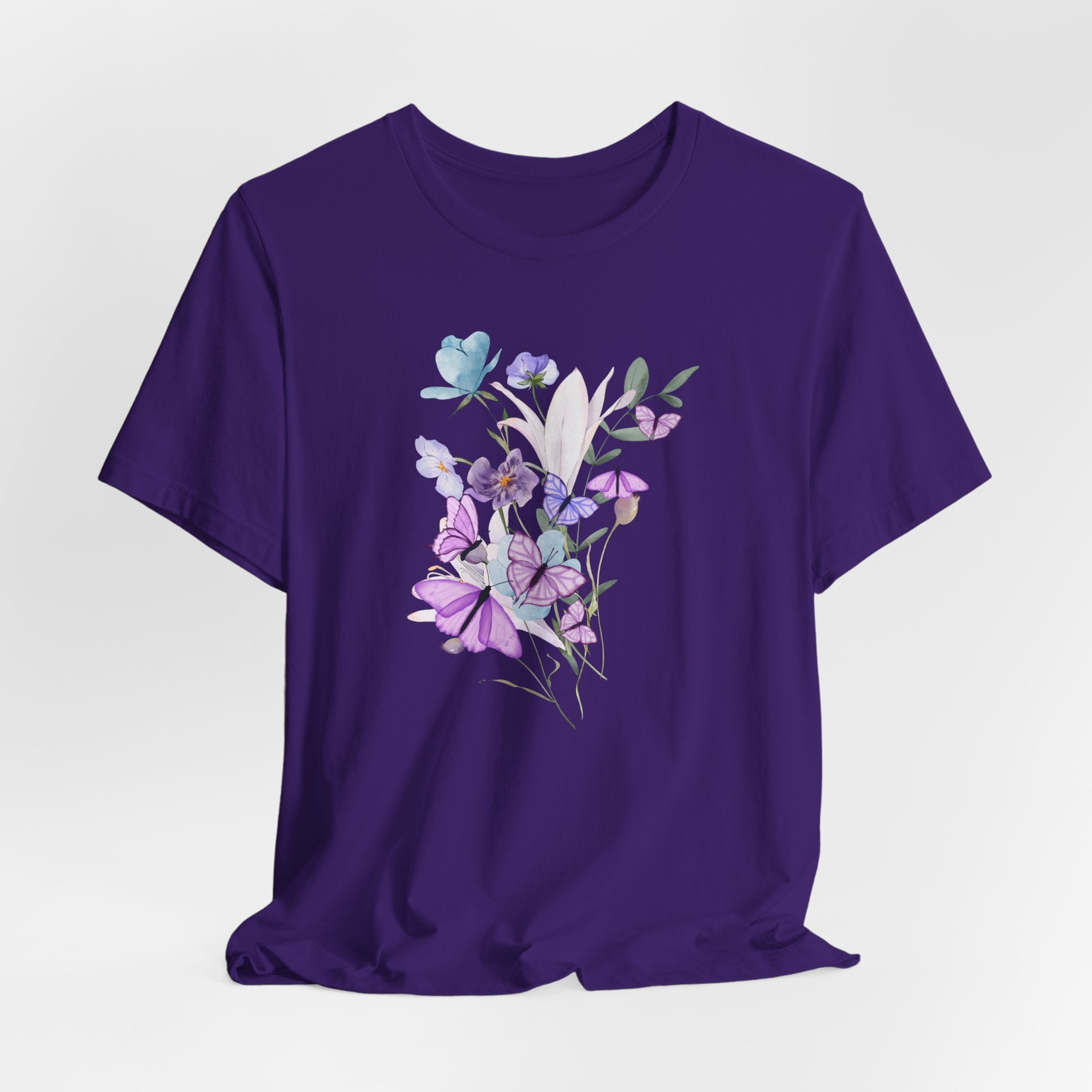 Purple t-shirt with floral design on a white background