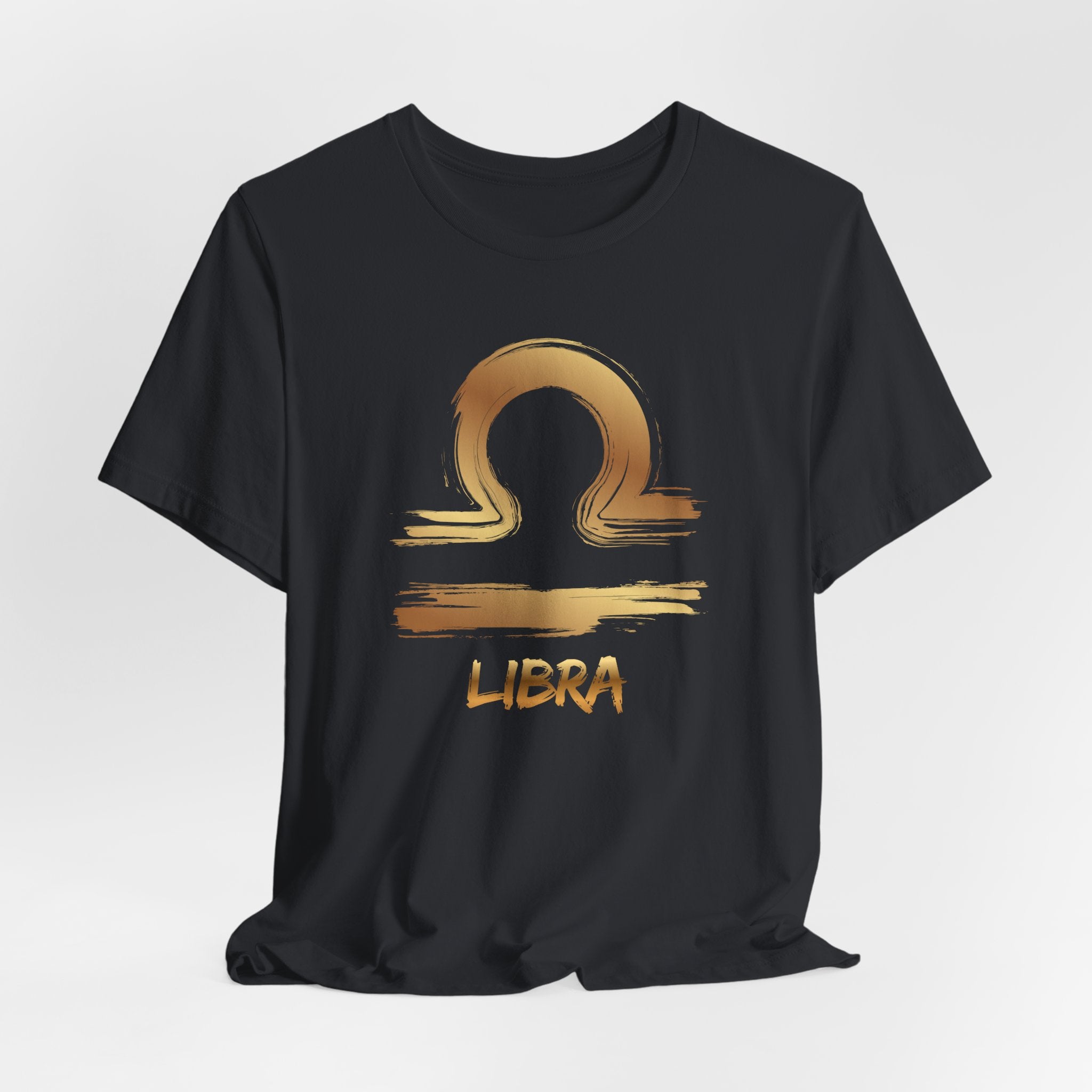 Black t-shirt with gold Libra zodiac symbol on a white background