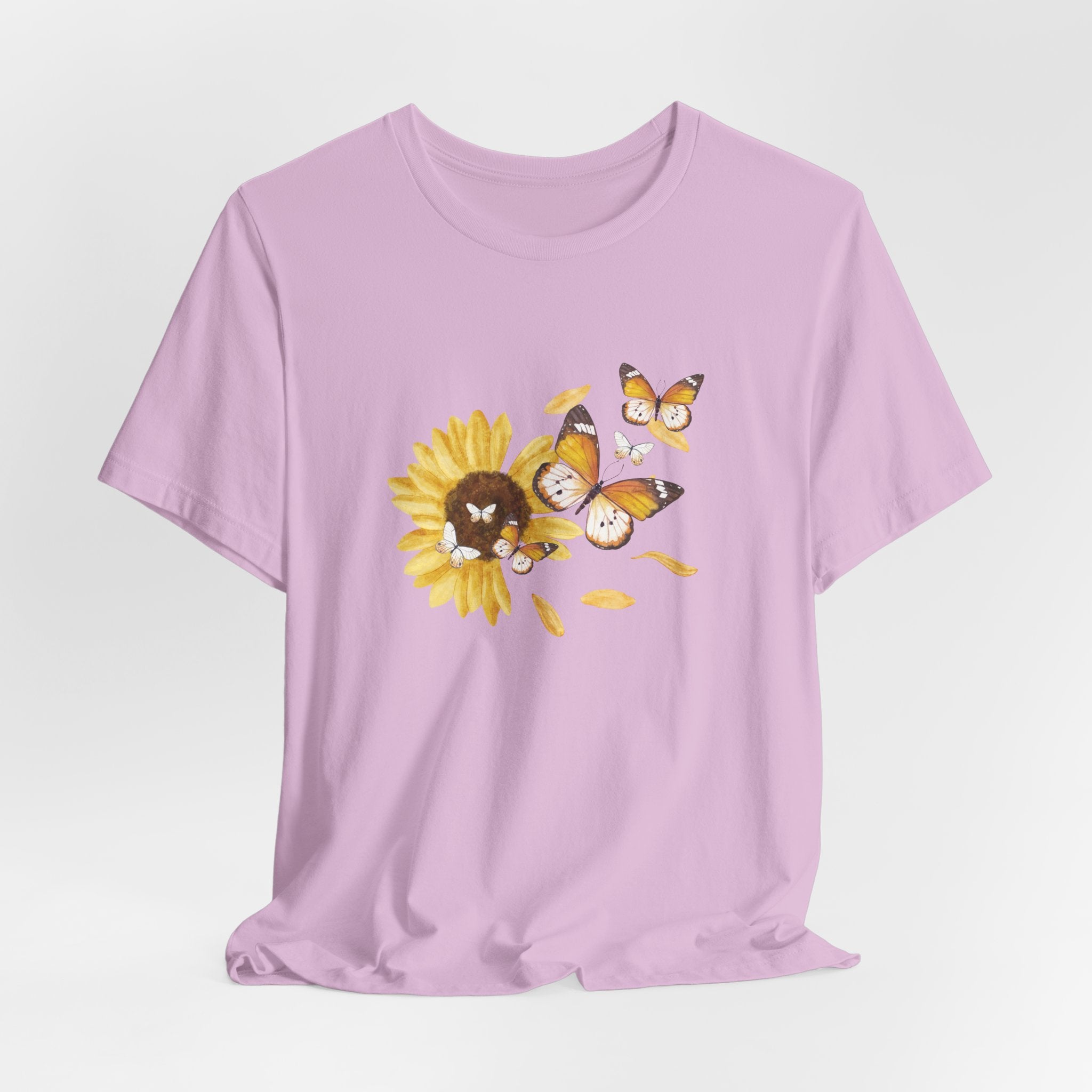 Purple t-shirt with a sunflower and butterfly graphic on a light gray background