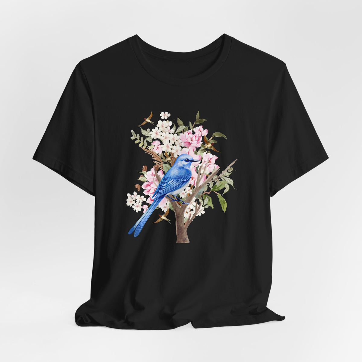 Black t-shirt with a blue bird and floral design on a white background