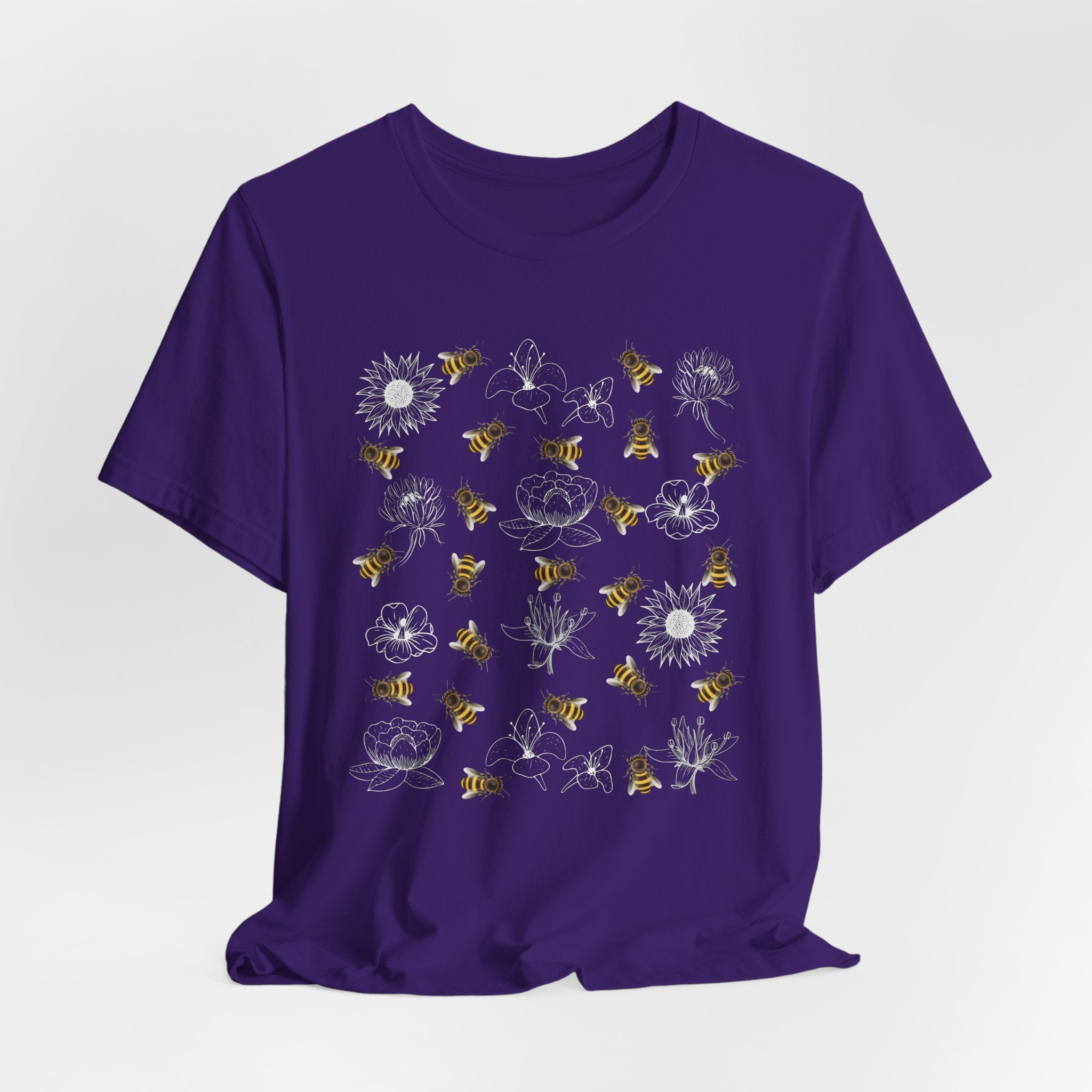 Purple t-shirt with bee and flower on a white background